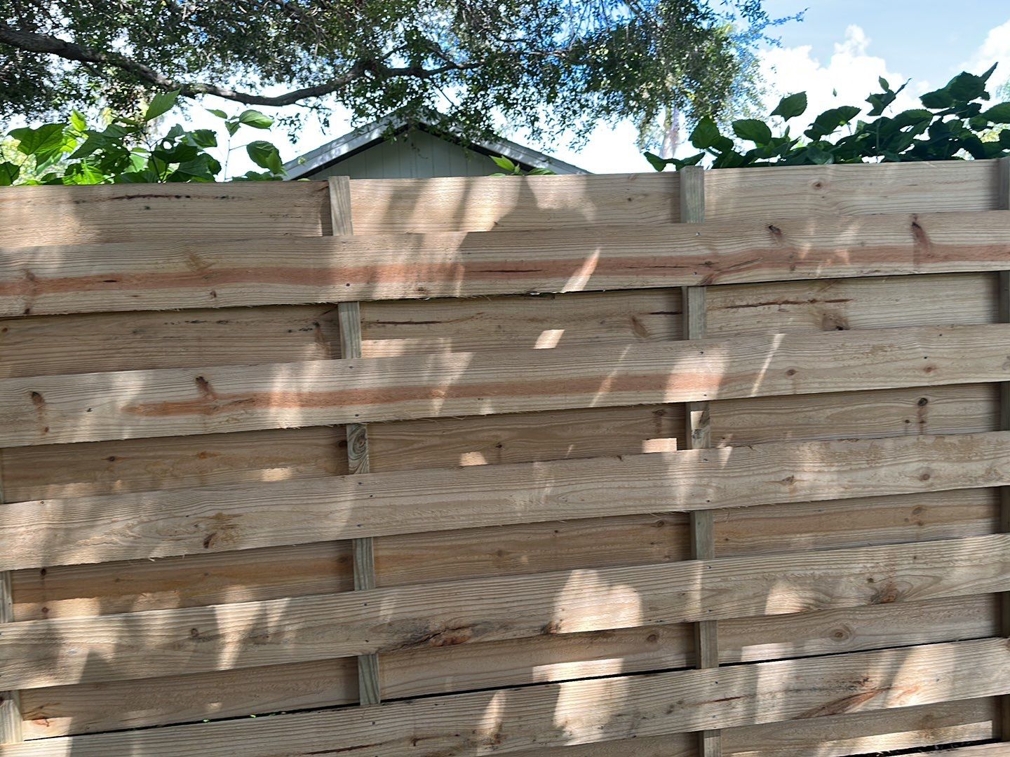Wood Fence Installation using Horizontal Shadowbox Wood Privacy Fence by Asap fence and gates, LLC