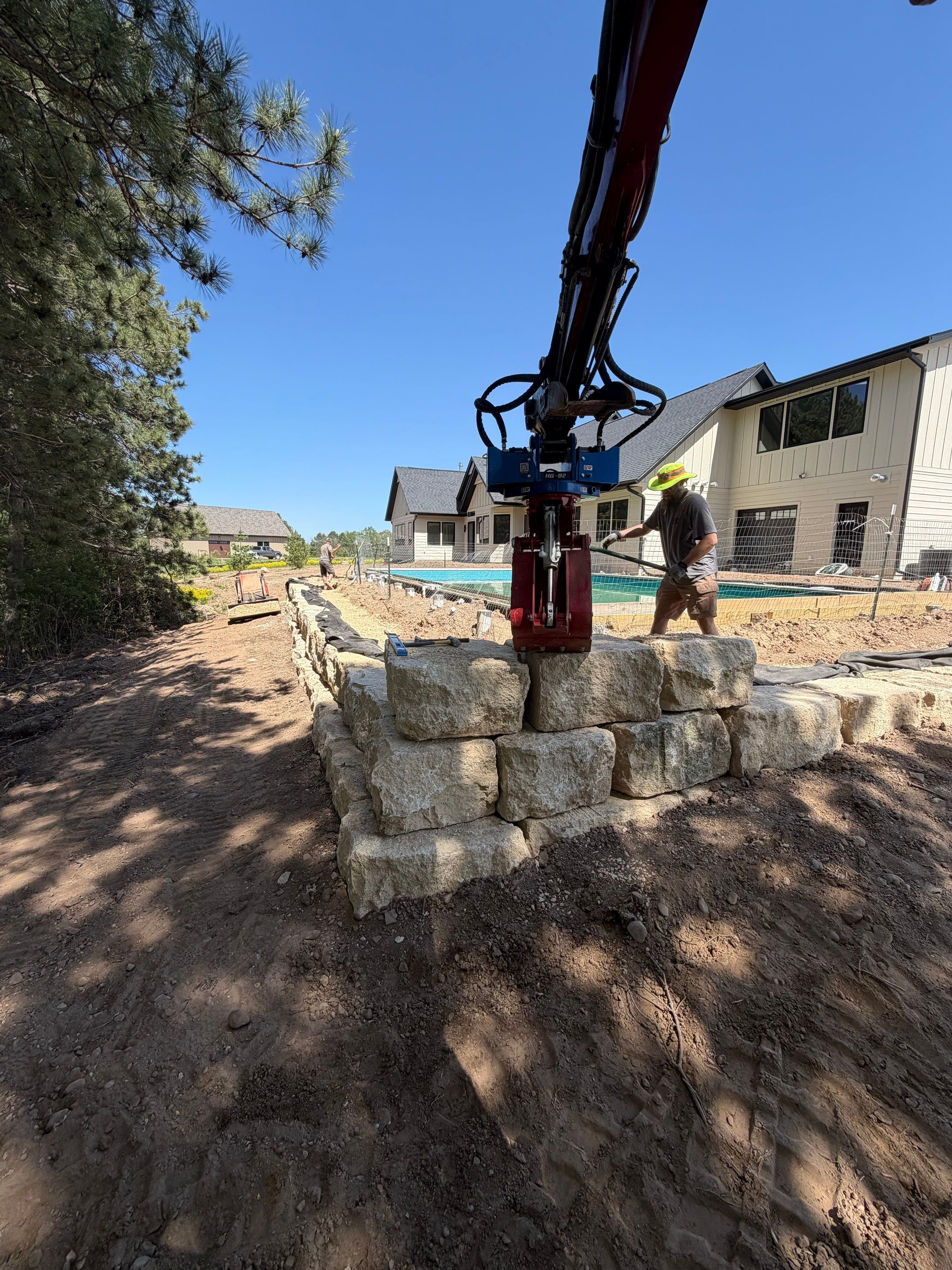 Limestone Boulder Wall by Sota landscaping