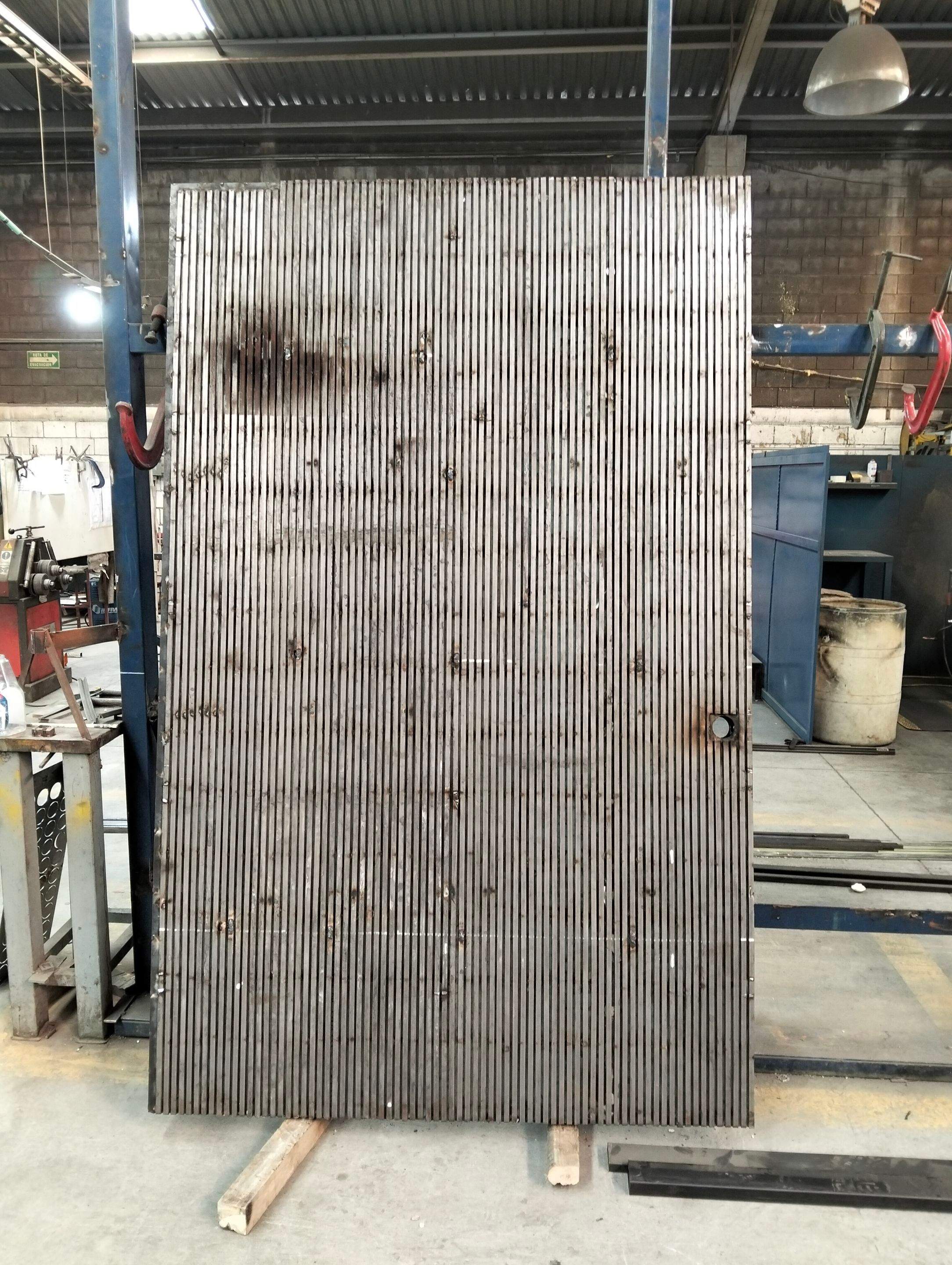 Custom Steel Oporto Pivot Door Installation for Dallas New Construction by Solara Custom Living
