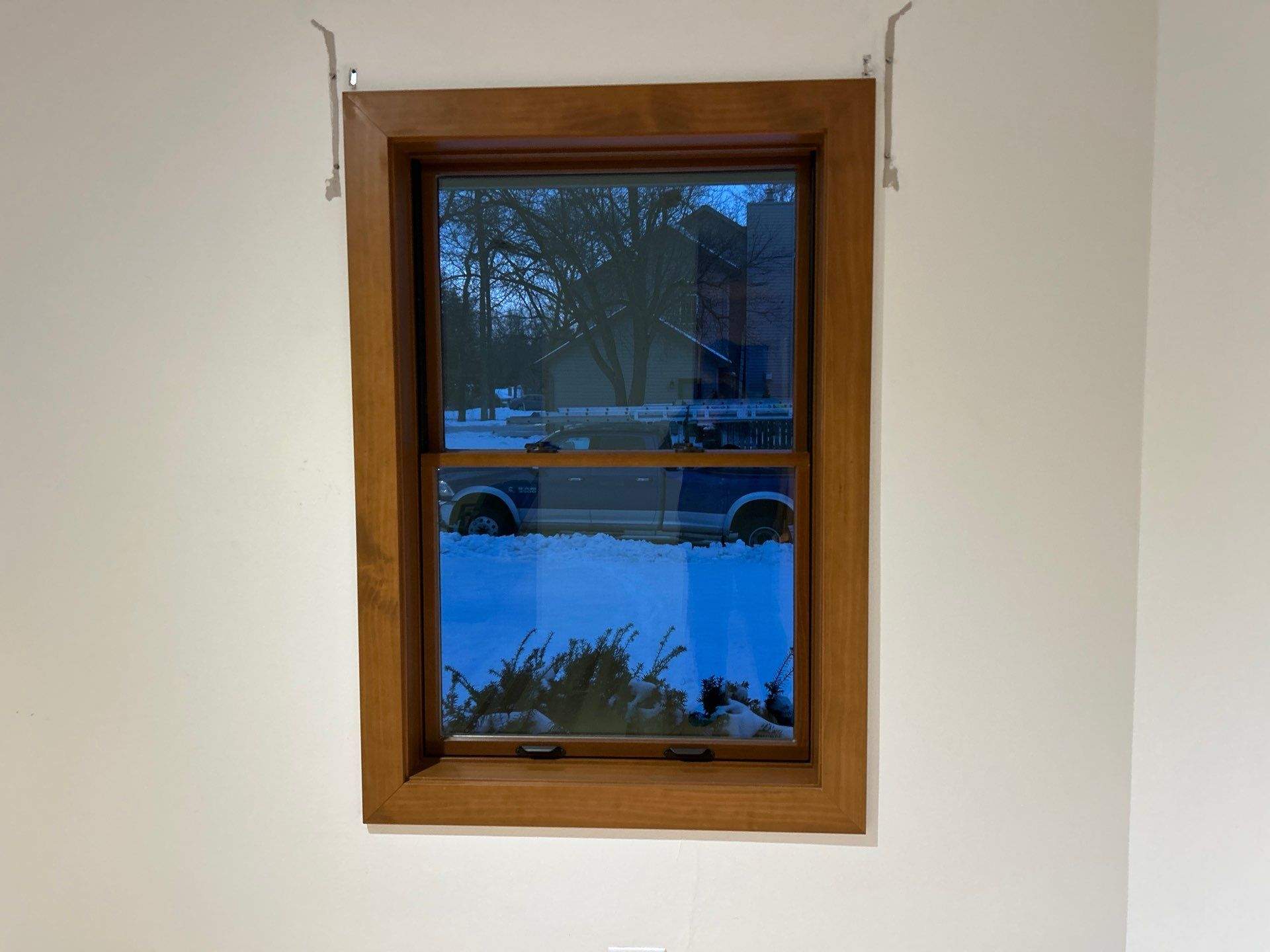 Black-Frame Pella Lifestyle Upgrade on a Partial Brick Home by United Windows and Siding LLC