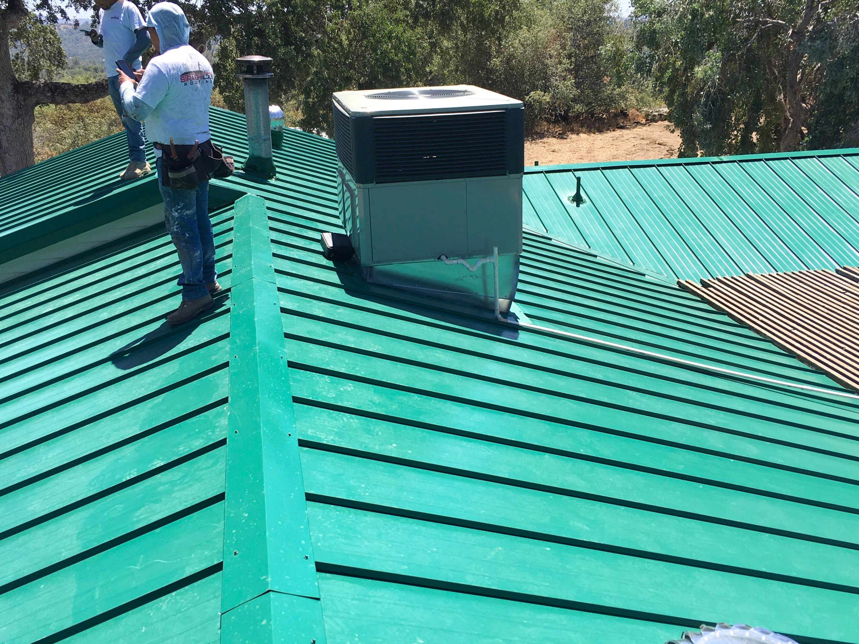 Metal roofing installation using Standing seam metal roofing system by Straight Edge Roofing Inc