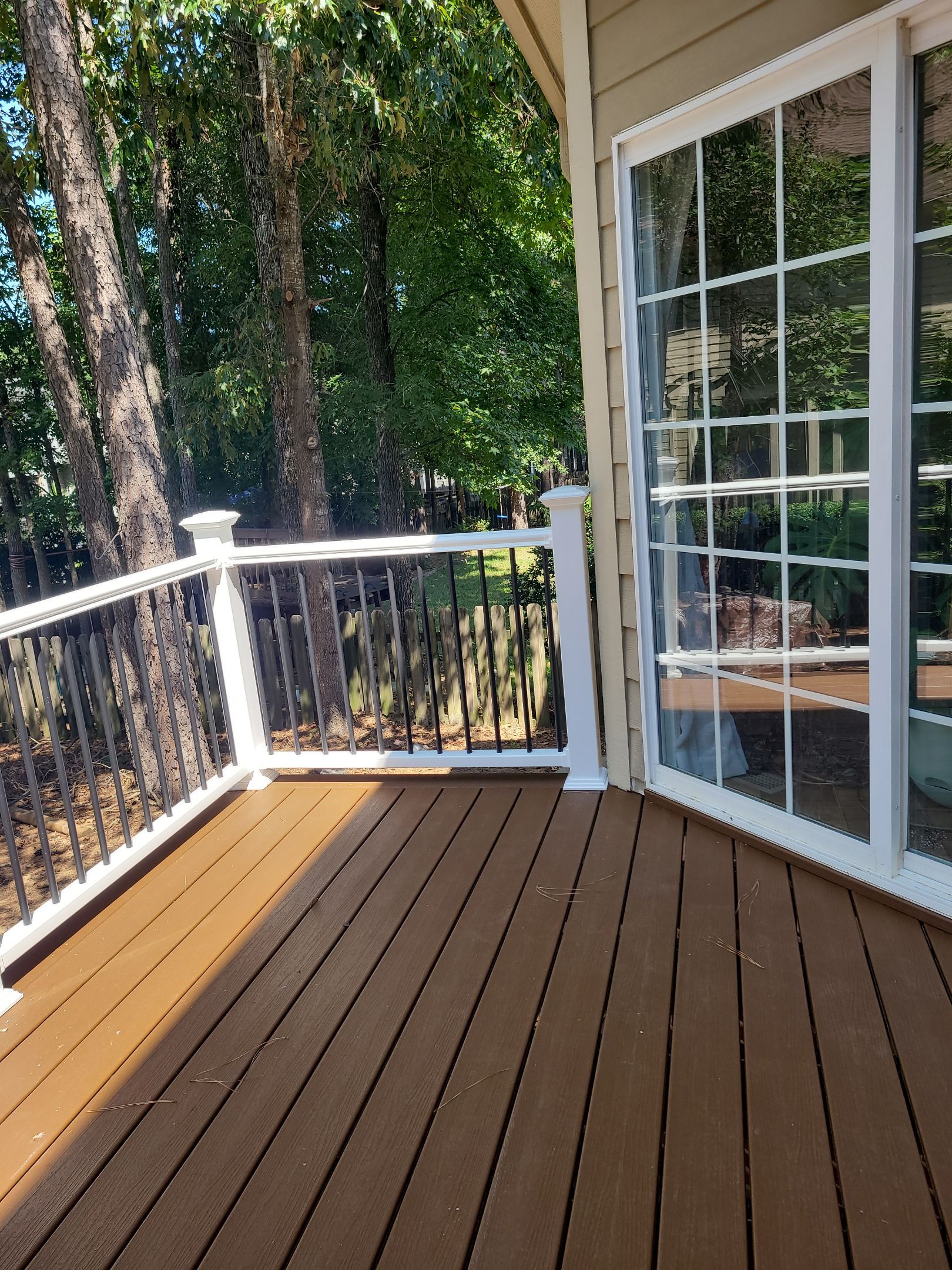 Fuquay-Varina Outdoor Upgrade – Composite Deck & Paved Landing by Elite Remodeling and Design LLC