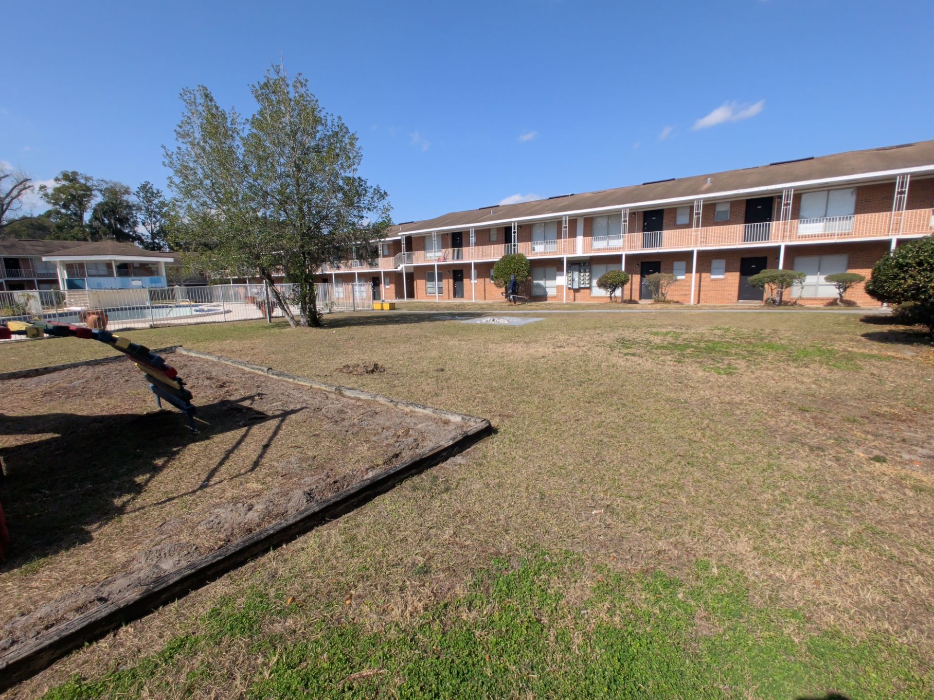 Apartment Landscape Cleanup & Ongoing Grounds Maintenance — Cimarron Apartments (Arlington) by Harmoni Home Services