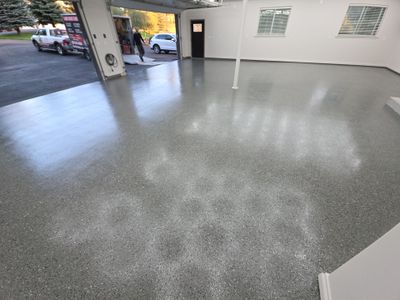 Custom Garage Transformation with Polyaspartic Coating and Hexagonal LED Lighting