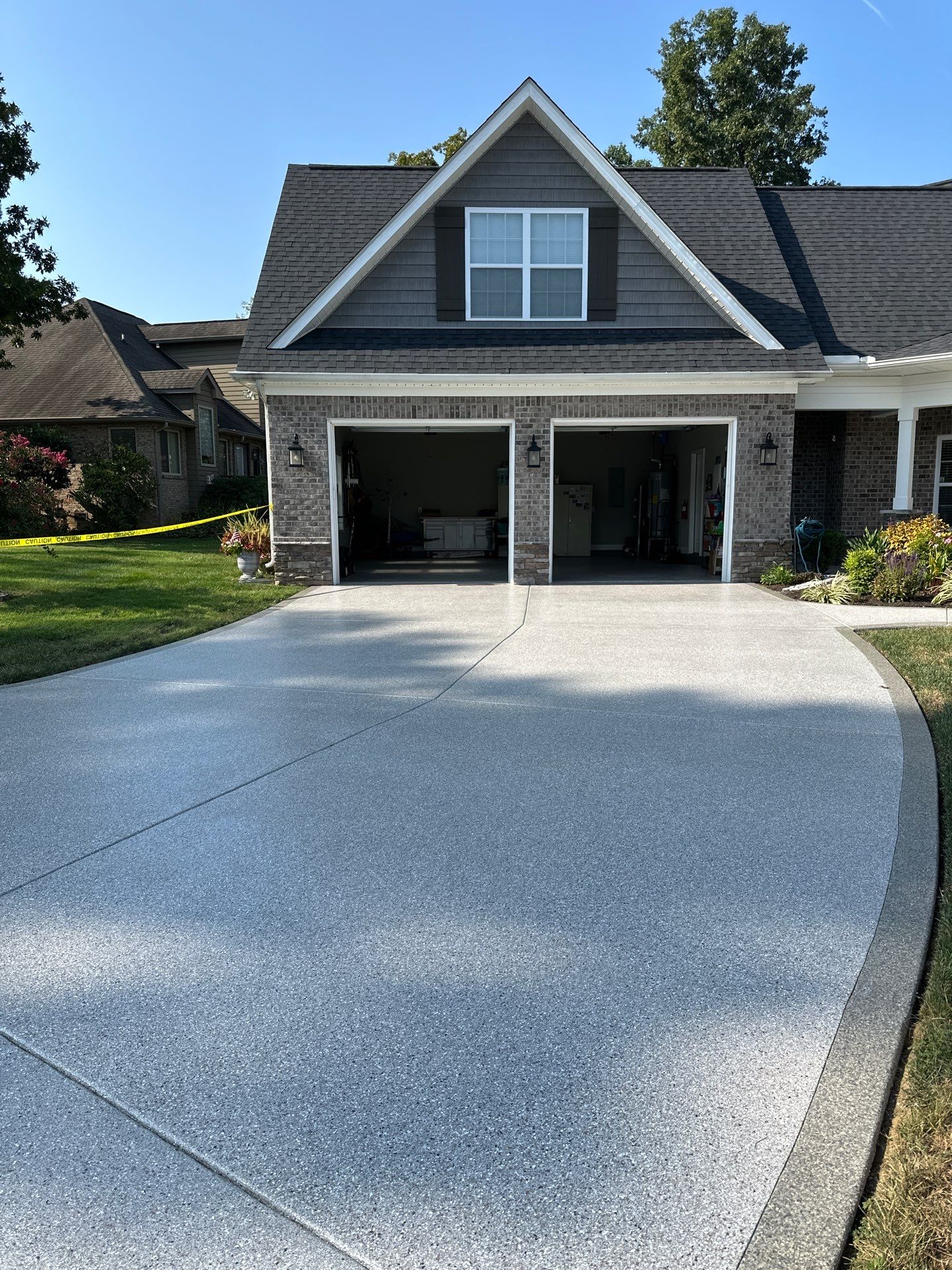 Driveway Improvement Using Claystone With Trail Mix Border! by Elite Floor Solutions
