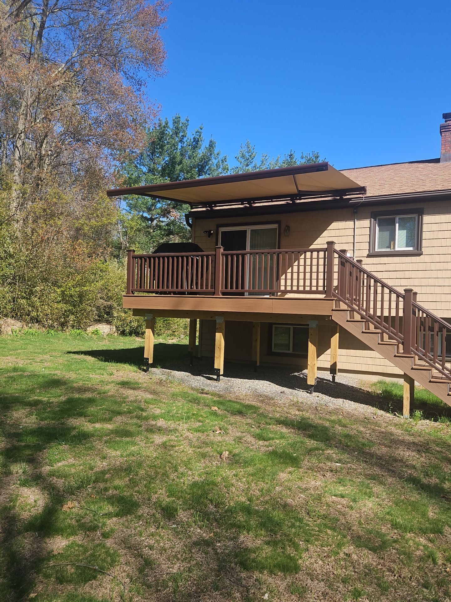 Retractable Awning Installation for Shade & Outdoor Comfort by DiGiorgi Roofing and Siding Inc