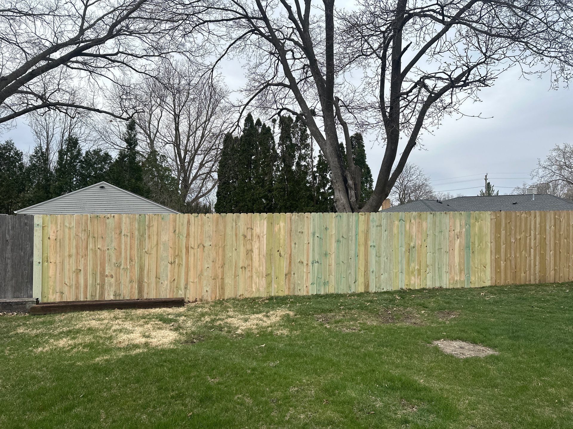 Pressure-Treated Wood Privacy Fence Replacement in Waterloo by Perfect Picket Fence and Stain