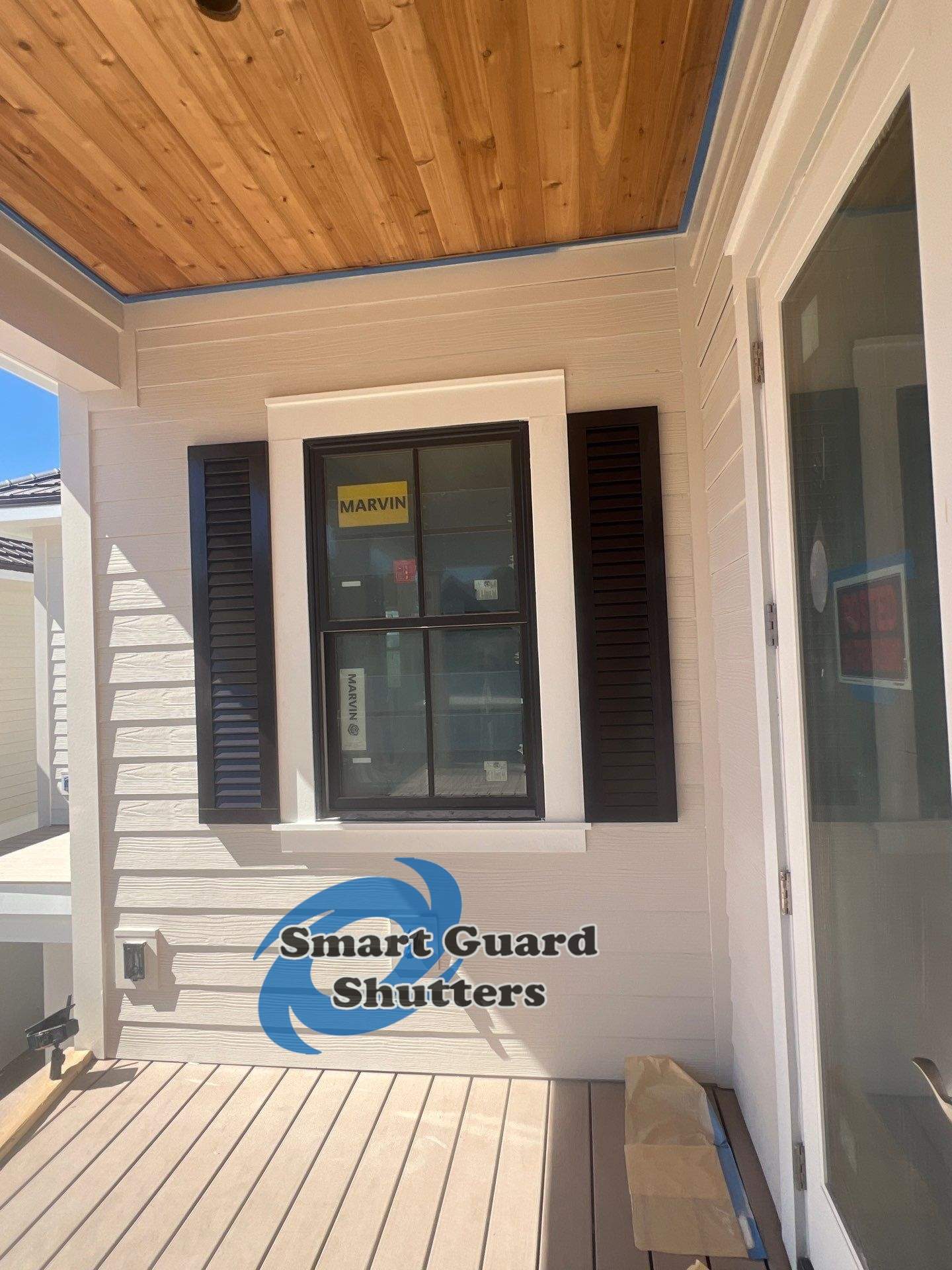 Decorative Colonial Shutters in Grey Brown by Smart Guard Shutters