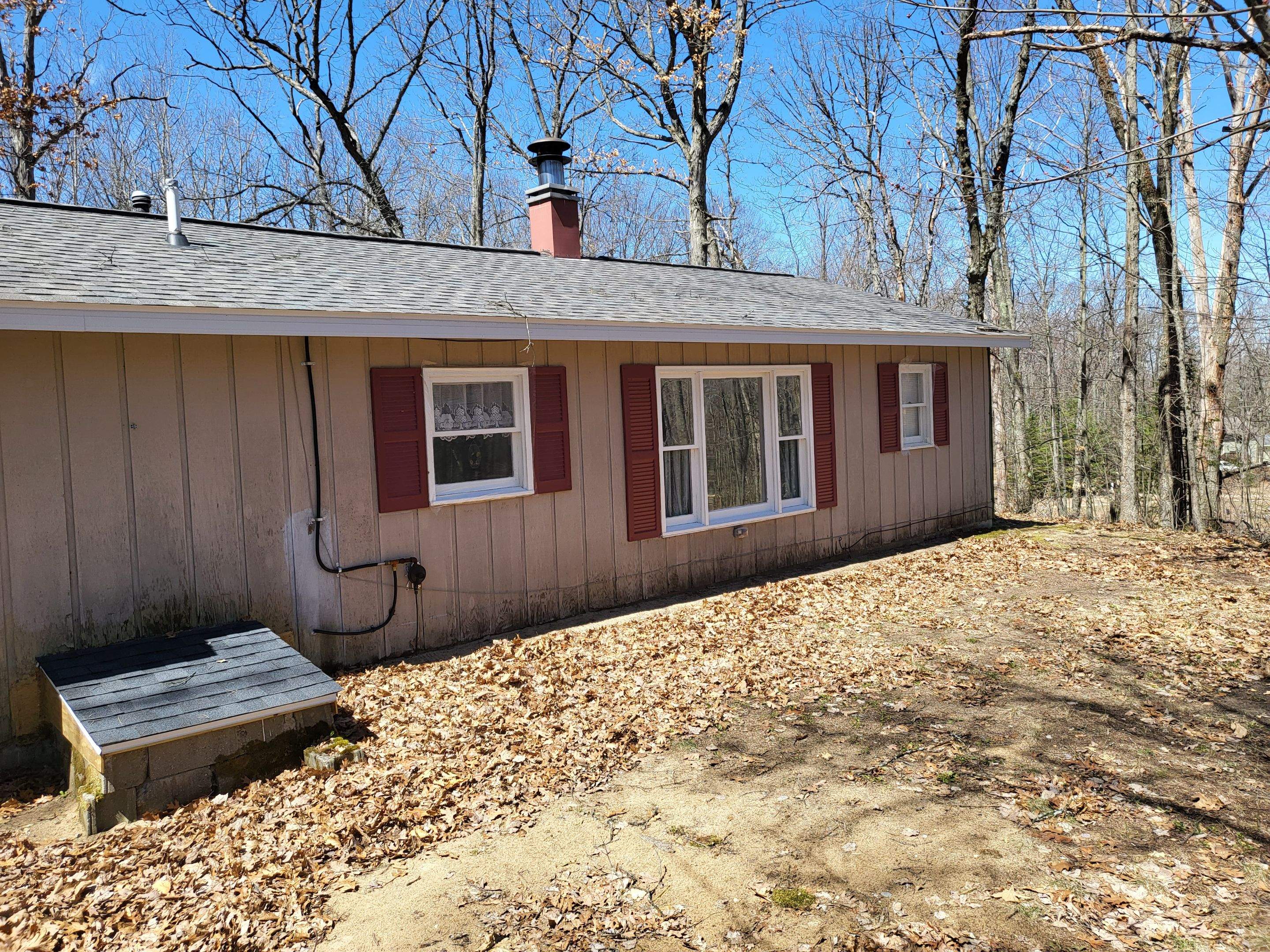 New addition and log siding by Energy Plus Home Improvements