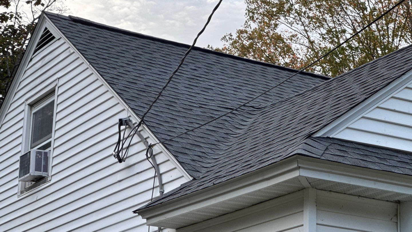 Complete Roof Replacement with GAF Pewter Gray HDZ™ Shingles, VELUX Skylights & New Gutters by Sensible Home Solutions