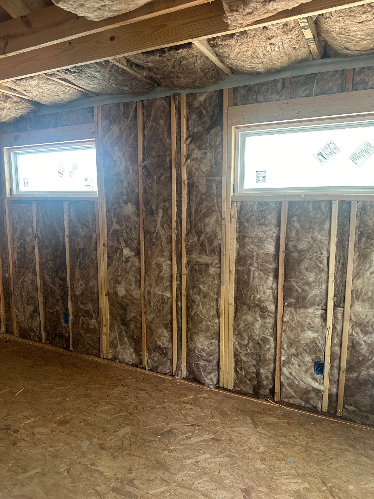 Fiberglass batt install on a second story addition in Dallas by Apex Insulation Solutions