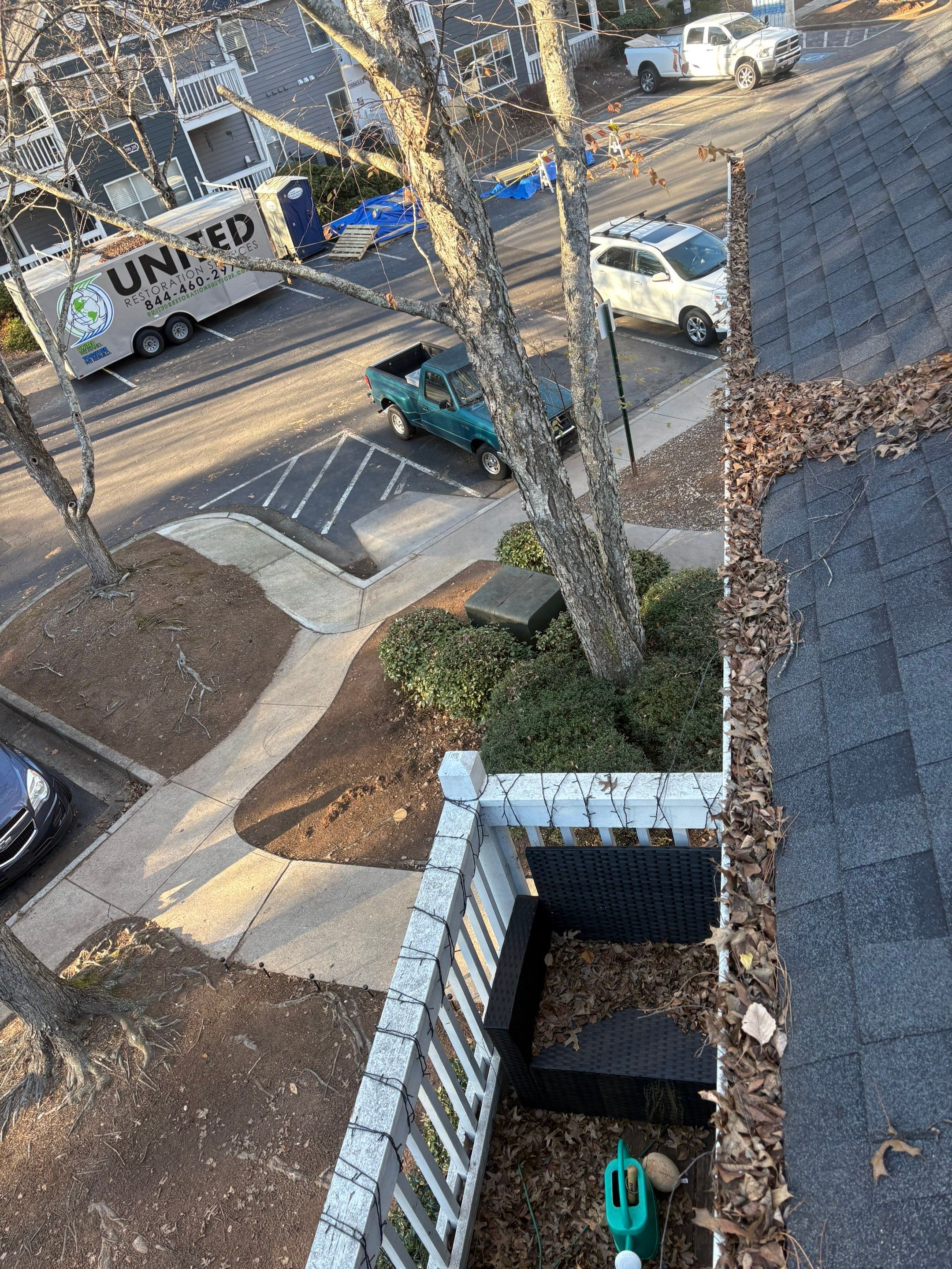 Commercial gutter cleaning Alpharetta & Roswell before photo with filled gutters