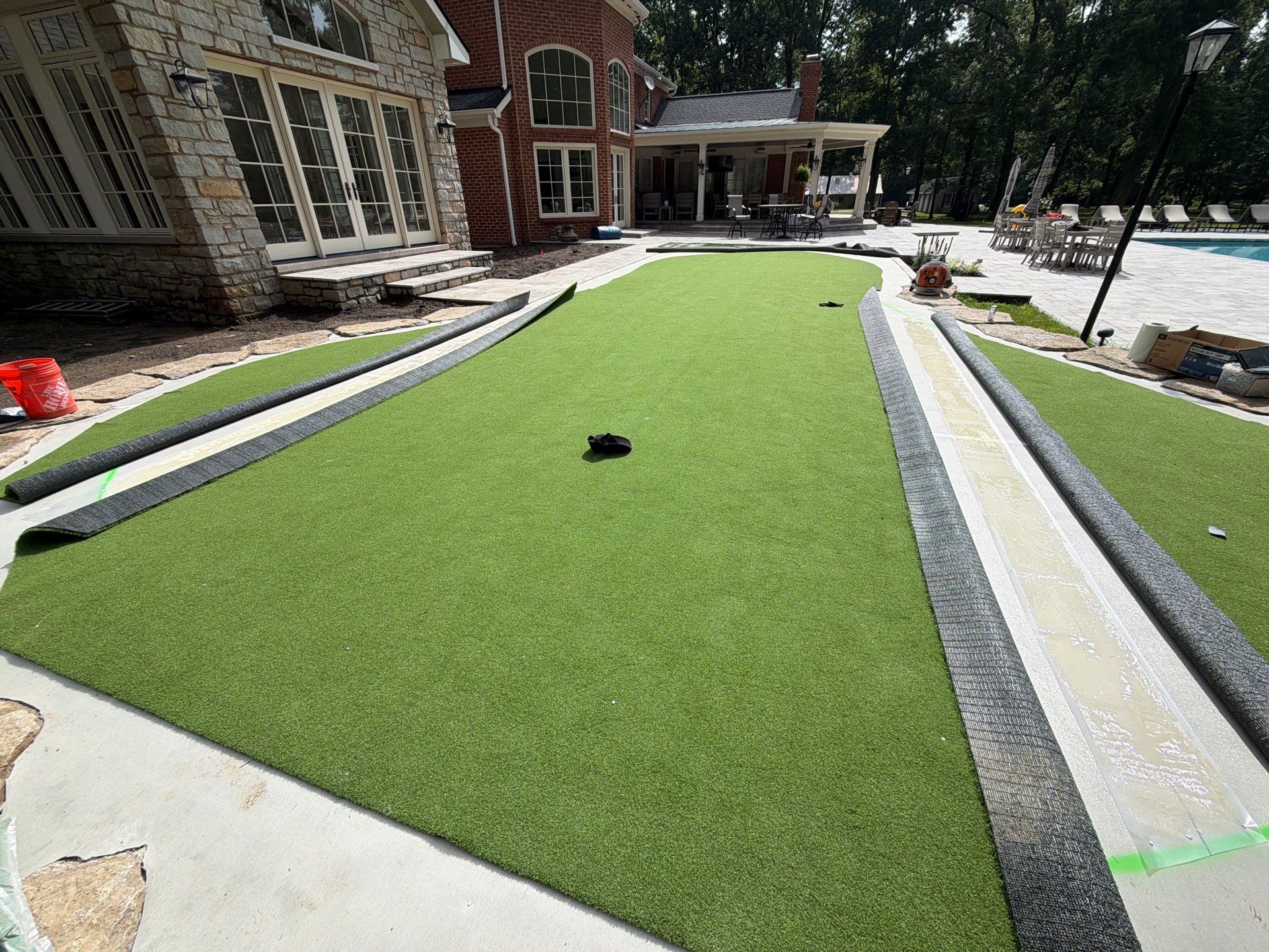 Custom Backyard Golf Green Accented by Flagstone Border in Morrow, OH by Southwest Greens Midwest