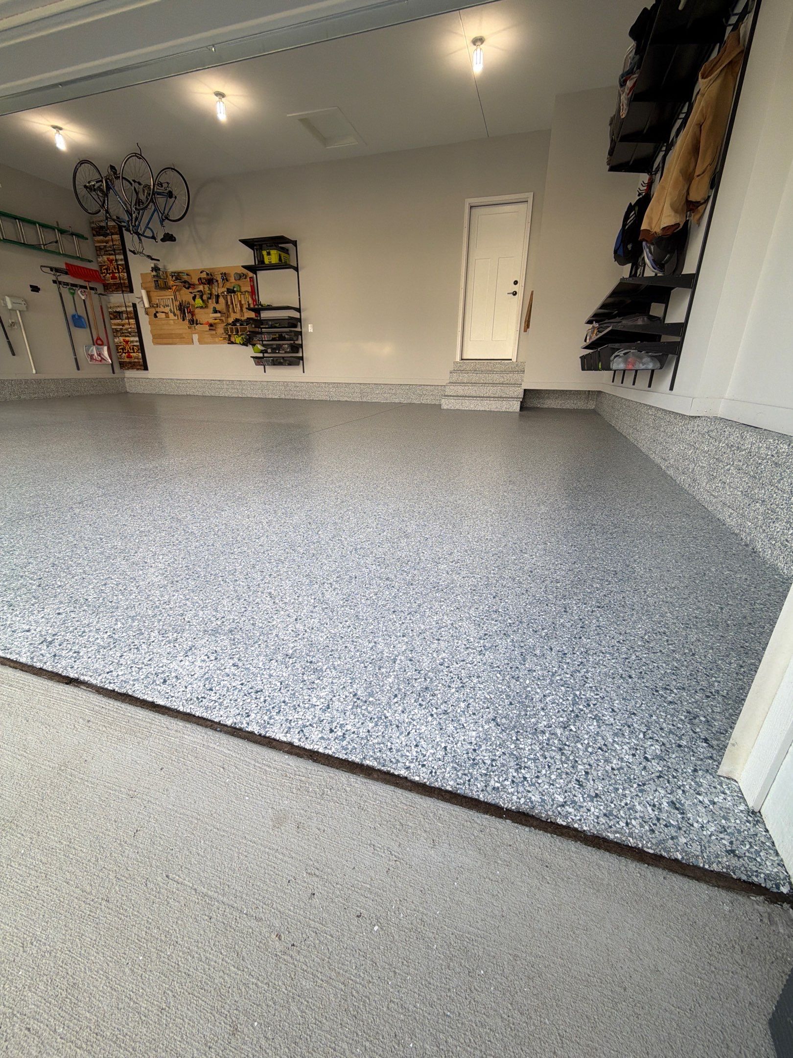 Waukee 3-Car Garage Transformation by Revival Concrete Coatings