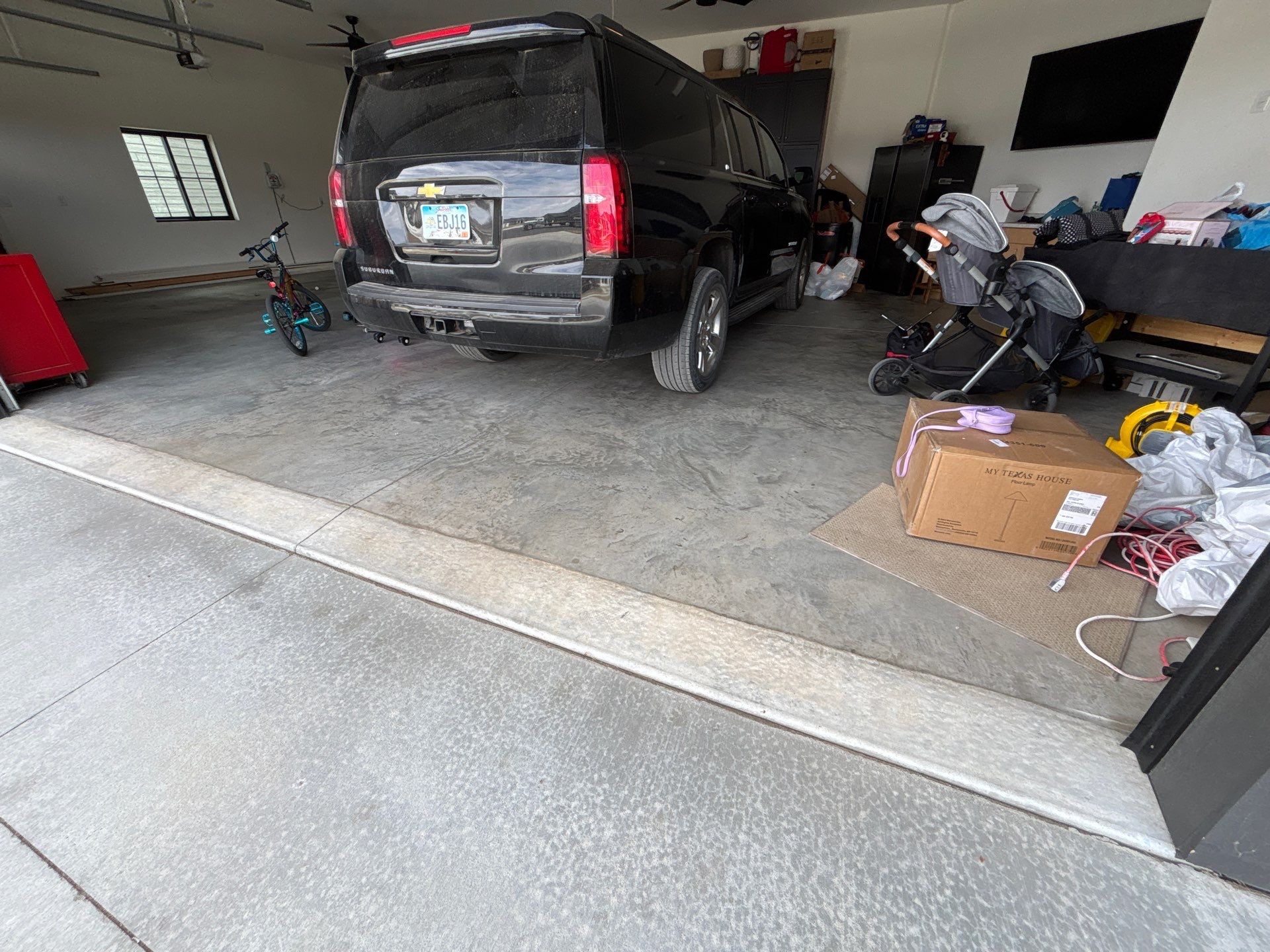 Custom Speckled Concrete Coating for Dell Rapids Garage by Select Painting, Coatings & Garage Cabinets