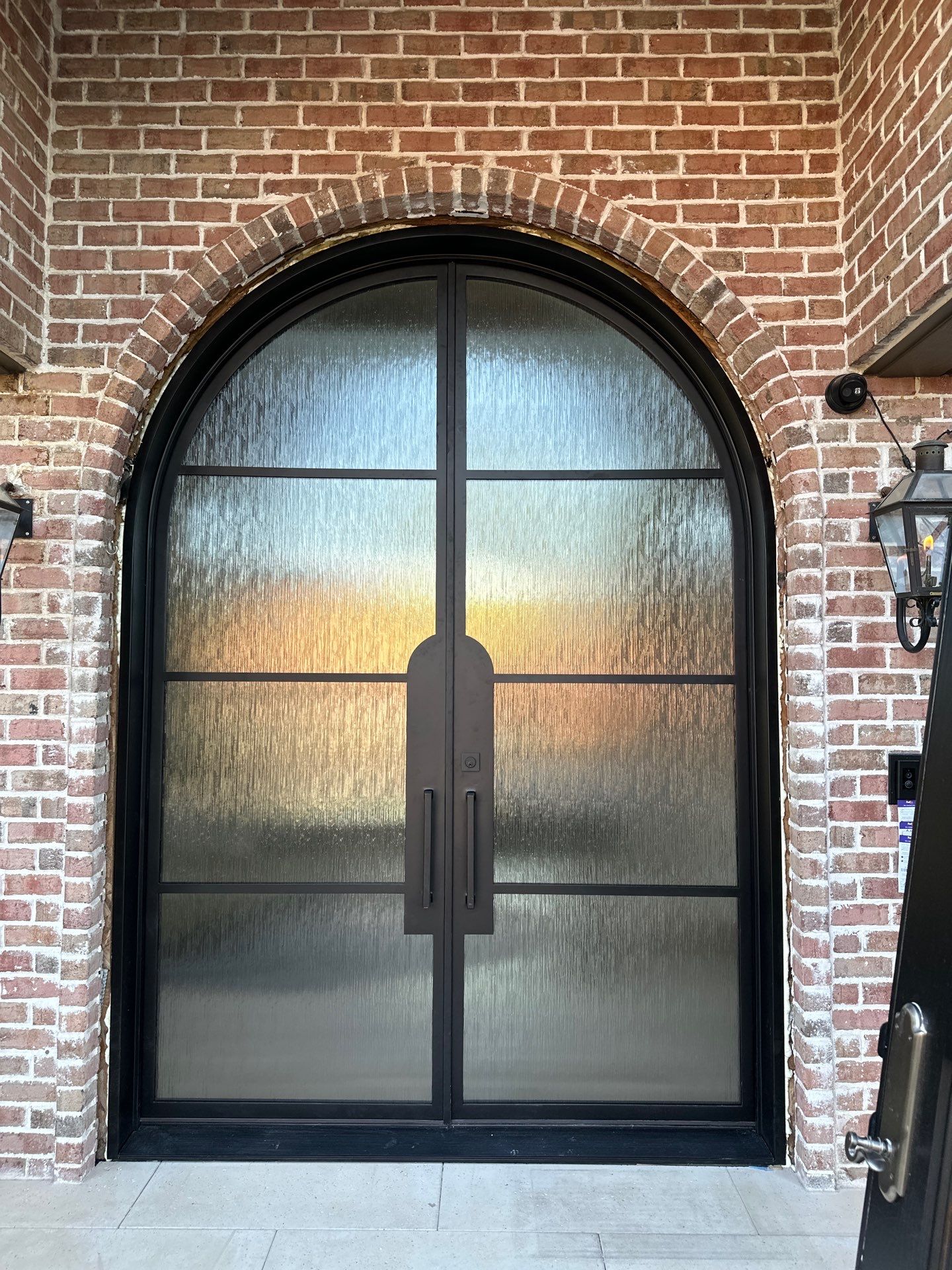 Custom Arched Metal Entry Door Installation in Plano by Solara Custom Living