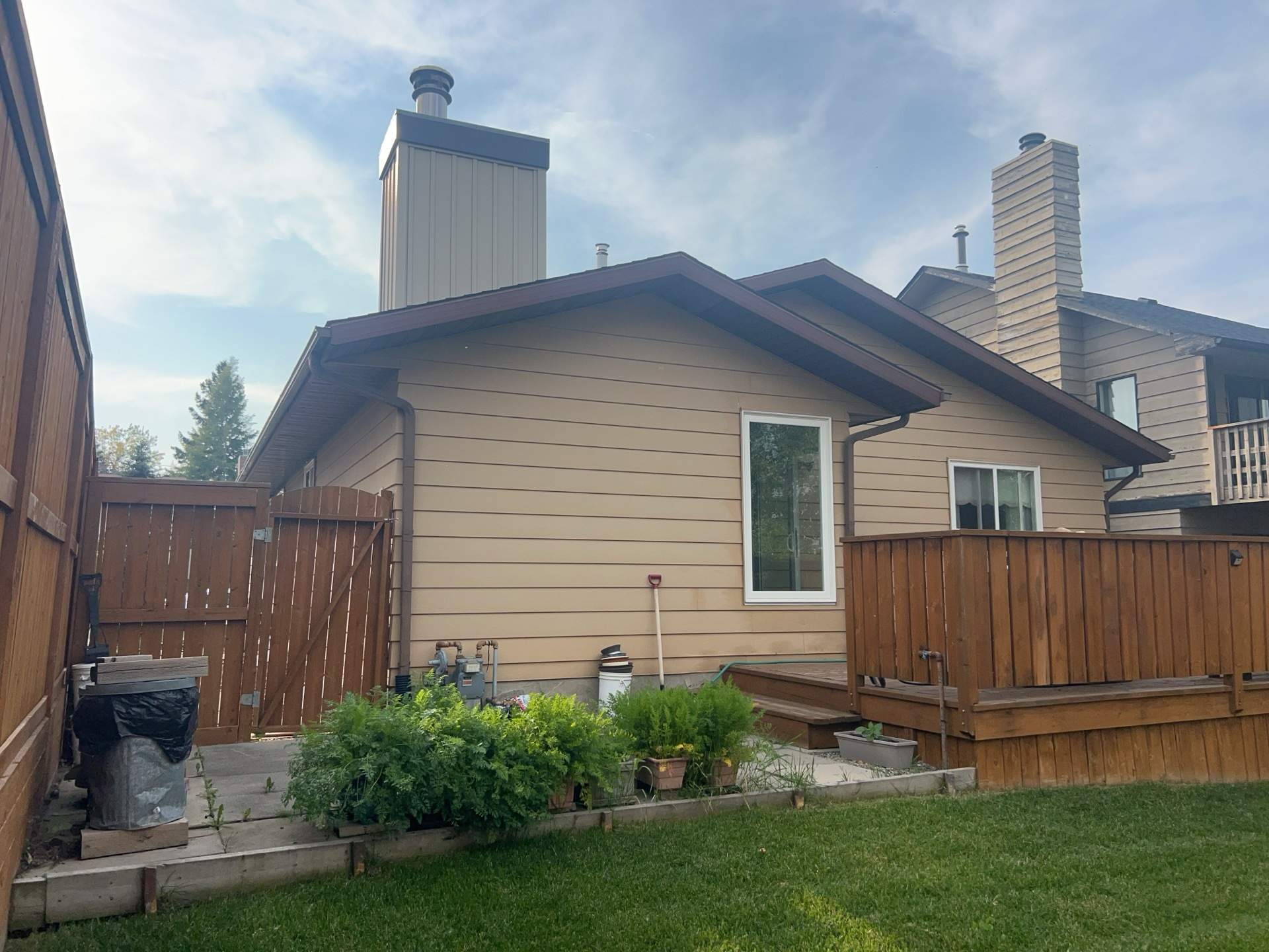 Calgary Chimney Chase Reconstruction and Exterior Siding Replacement by Smart Home Building Systems Ltd.