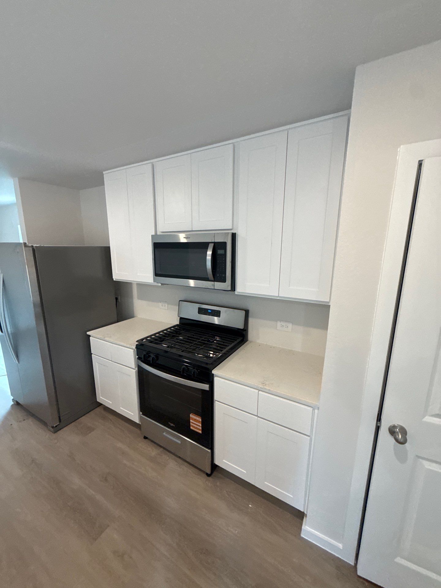 White Shaker Kitchen Cabinet and Bathroom Vanity Installation in Willis by Roaring Lion Renovation, LLC