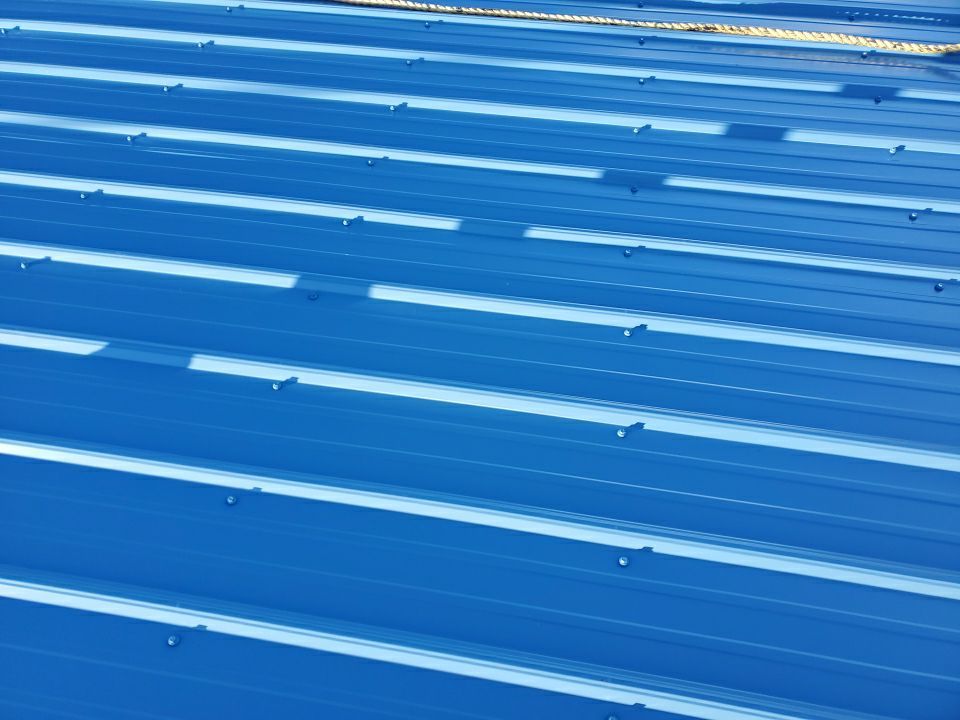 Commercial Roofing Installation using Metal roofing by American Roofing & Construction LLC
