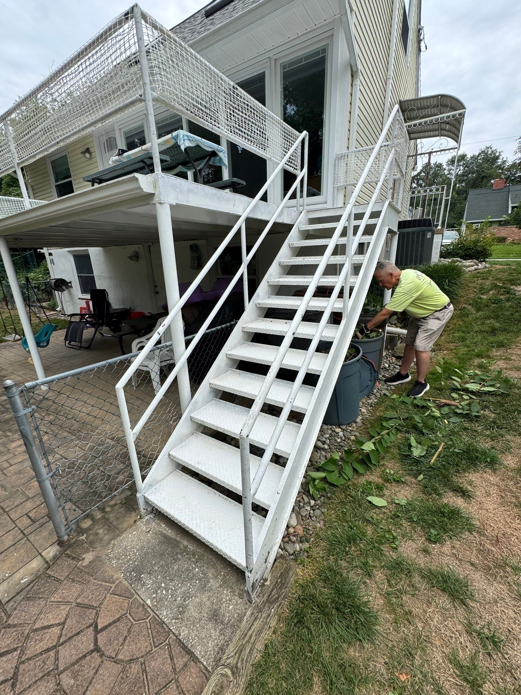 White Powder-Coated Outdoor Railings in Rockville & Staircase and Deck Refurbishment  by Capitol Iron Works