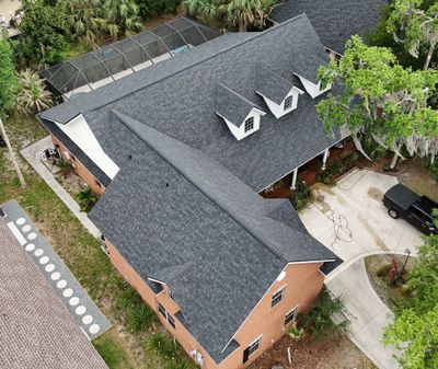 Comprehensive Onyx Black Asphalt Shingle Roof Replacement for Flagler Beach Residence by Trinity Restoration and Roofing LLC