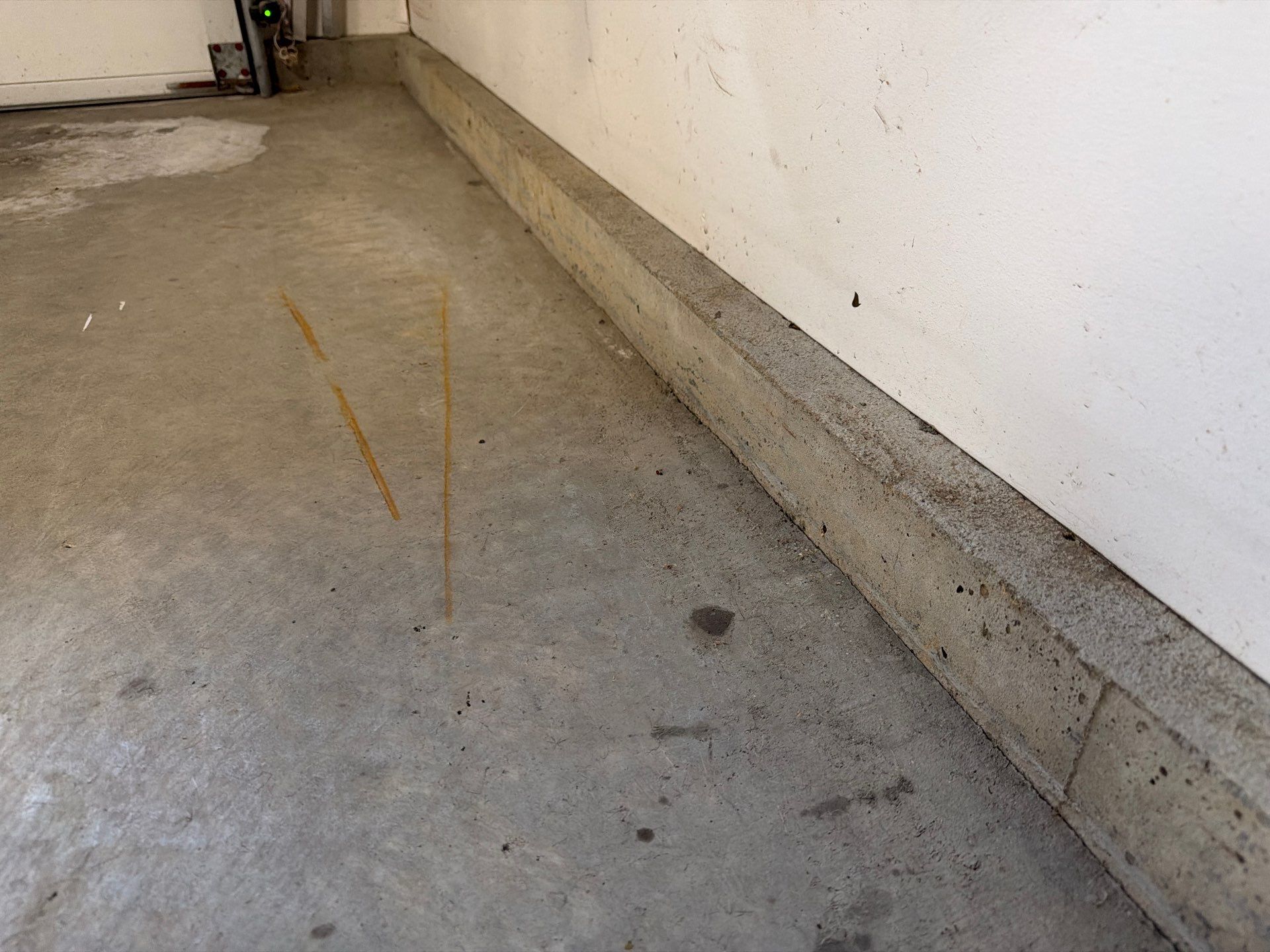 Feather Grey Garage Floor Coating Installation in Sioux Falls by Select Painting, Coatings & Garage Cabinets