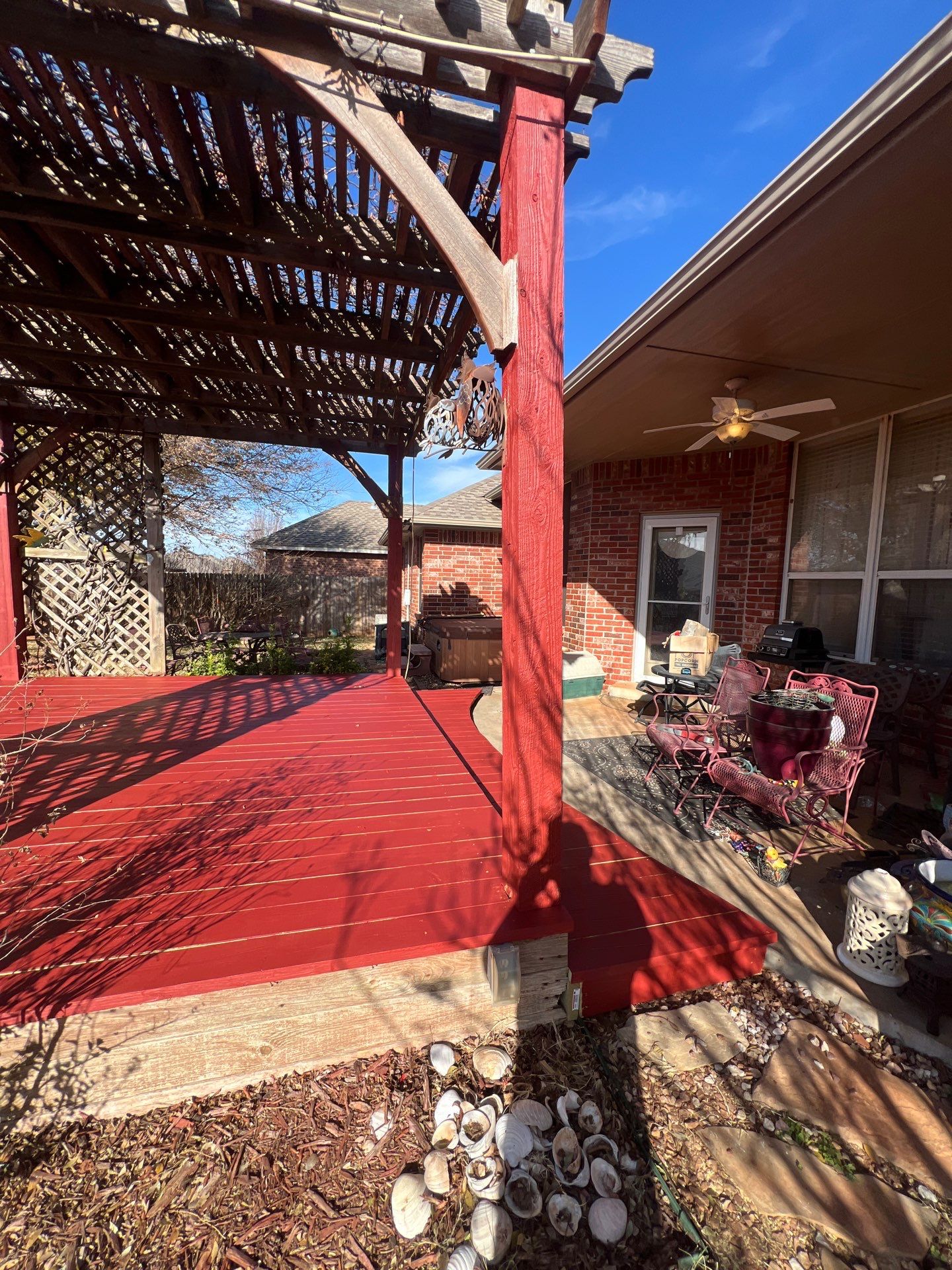pergola installation and painting in Yukon by McCann's Roofing and Construction