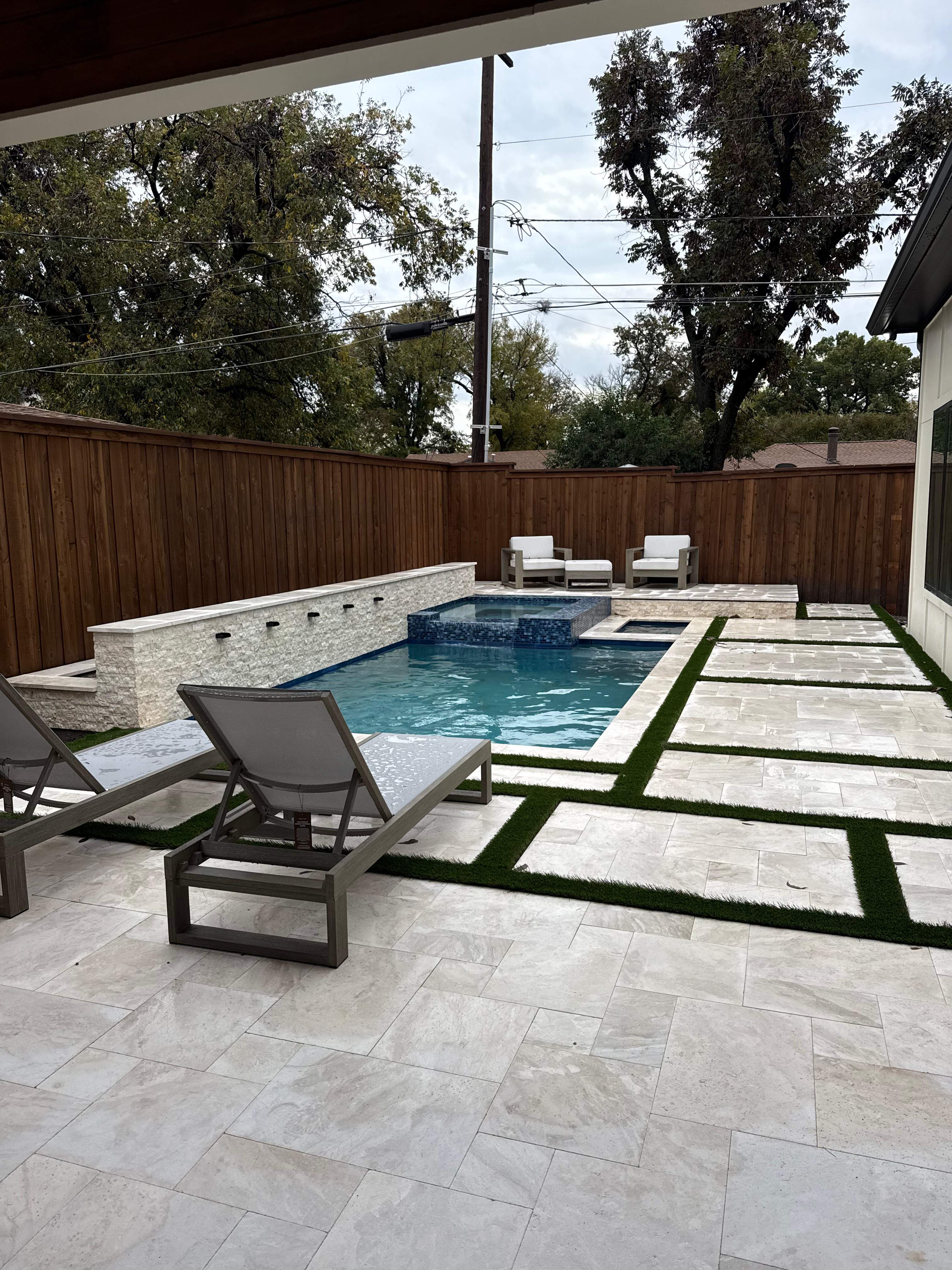 Modern Geometric Pool and Spa with Turf-Strip Decking by Pinnacle Pools and Spas - DFW