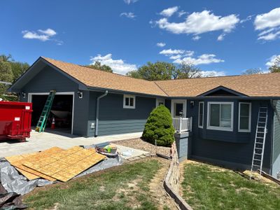 Evening Blue Siding and Window Replacement in Glenwood, Iowa