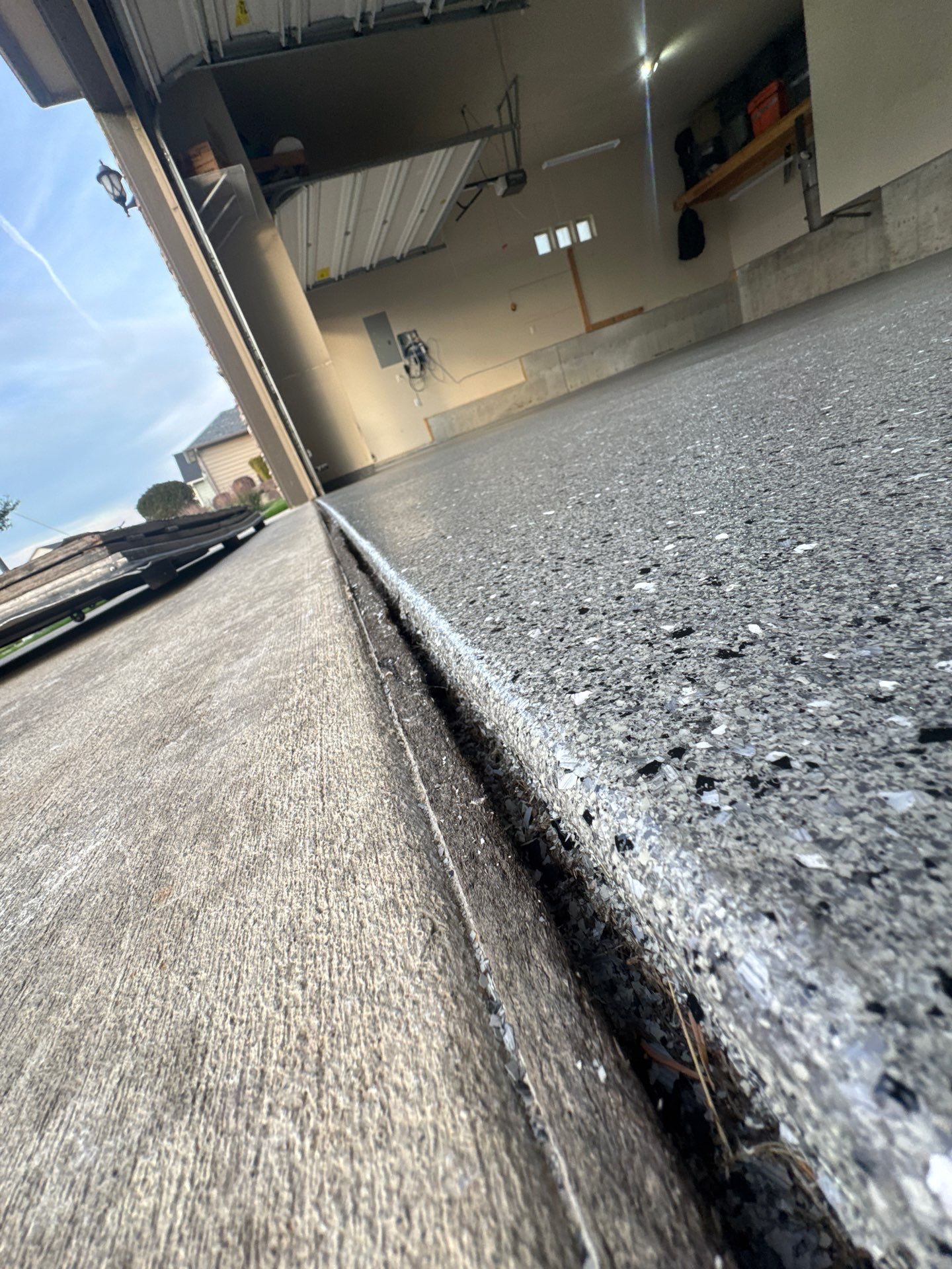 Custom Gray Speckled Polyaspartic Garage Floor Coating in Cheney by Croc Coatings, LLC