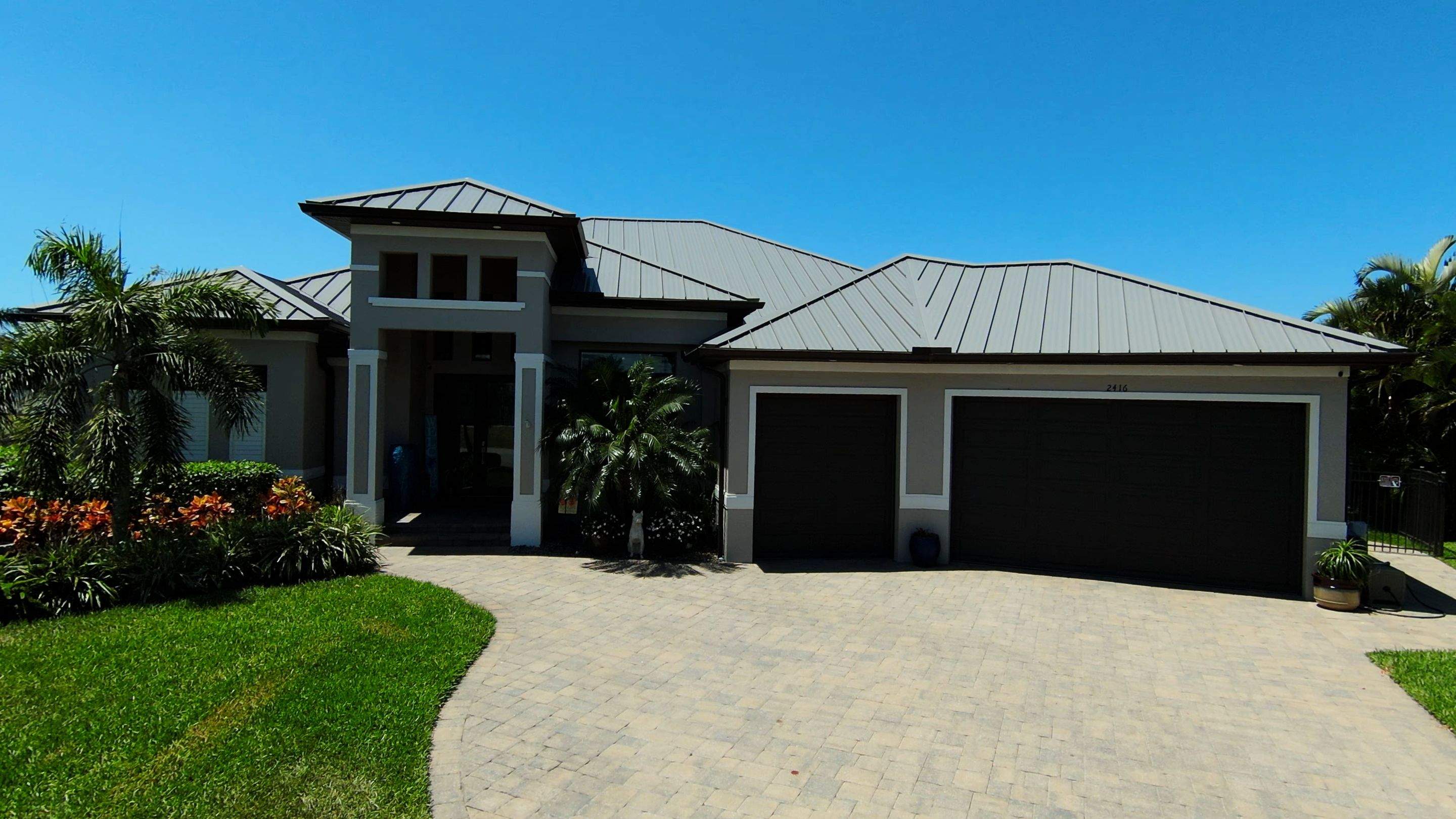 Residential Roofing Installation using Gulf Coast Metals Gulf Seam Panels by Four Peaks Roofing