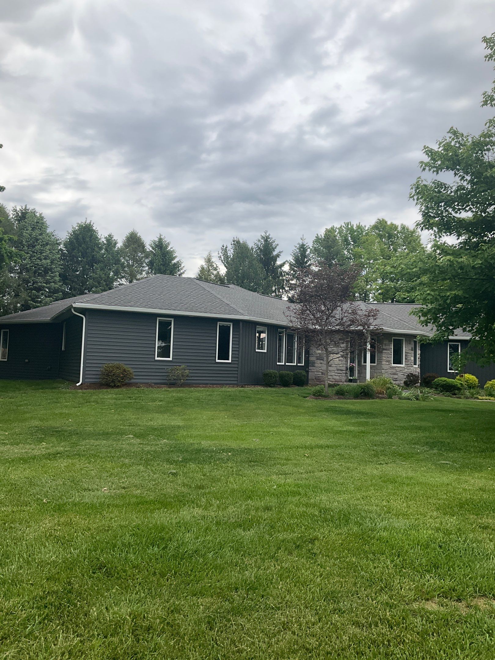 Nightfall Exterior Siding Replacement and Stone Veneer in Halifax by Esh Builders