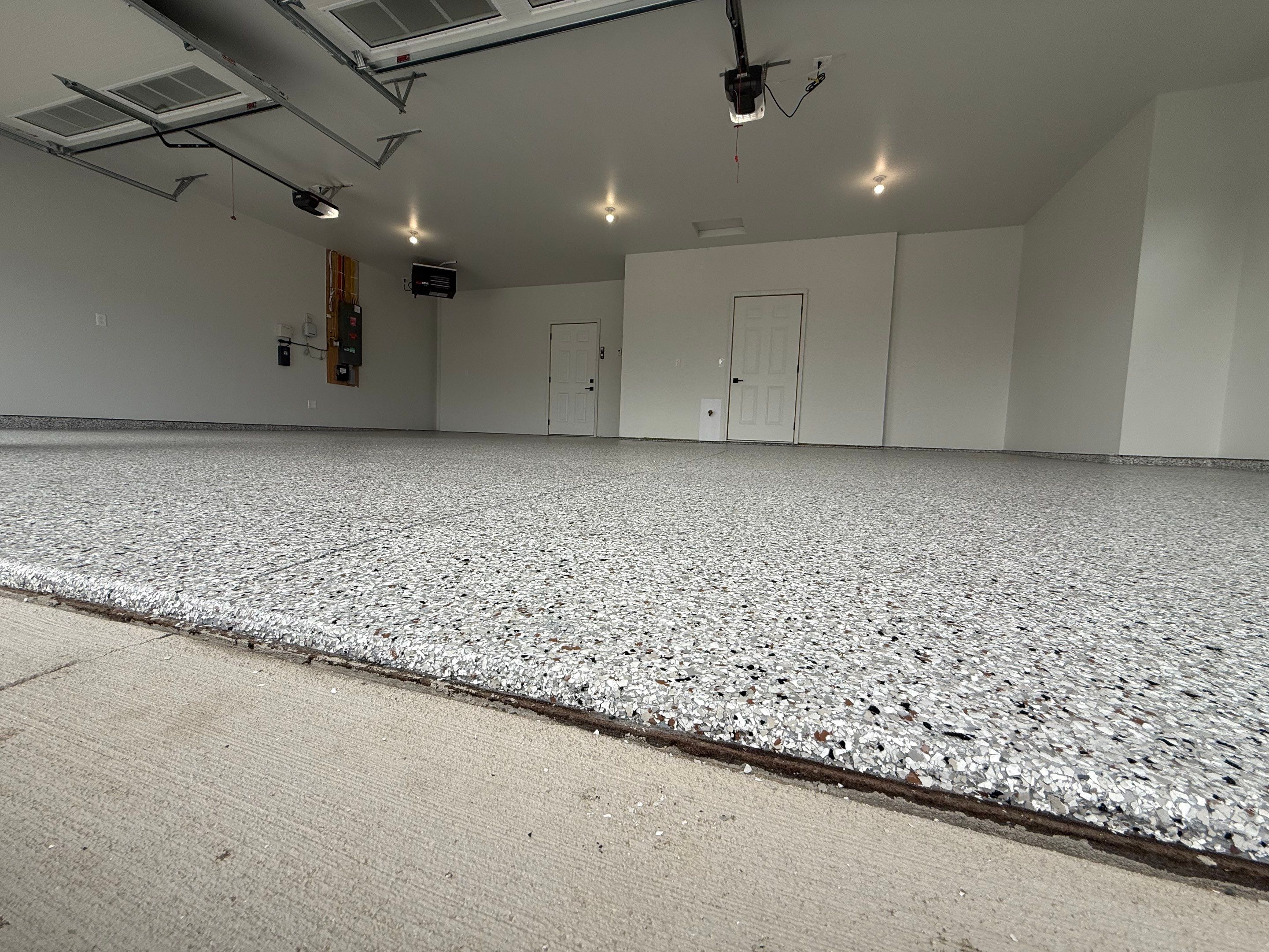 High-Gloss Epoxy Flake Garage Floor Coating in Brandon by Select Painting, Coatings & Garage Cabinets