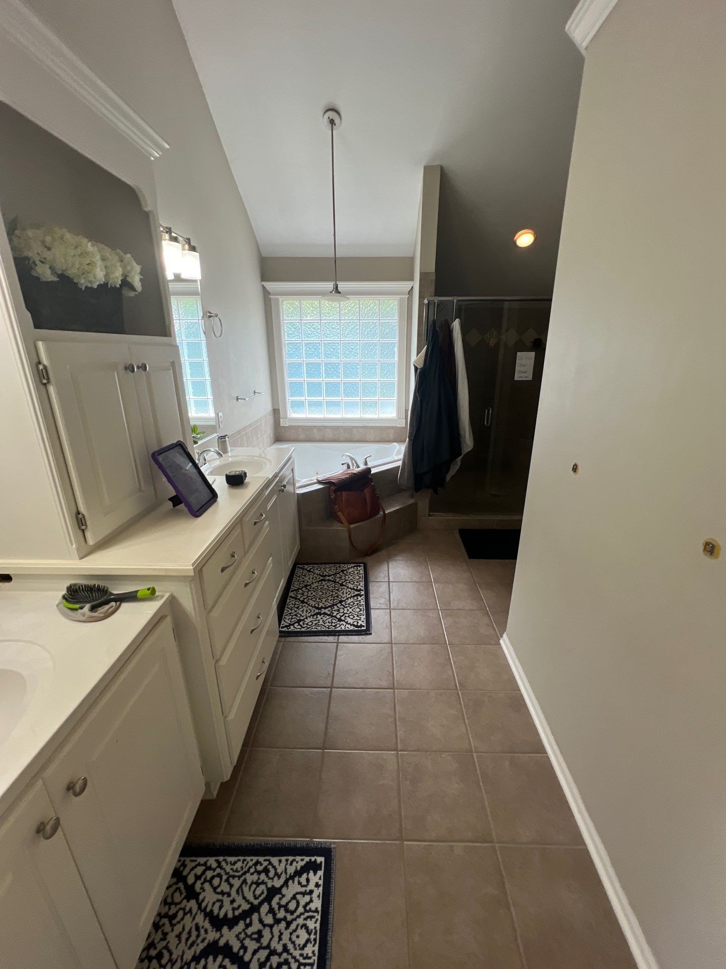 Full bathroom remodel with Artus lighted mirrors, Waltz bathtub and Mercury doors by The Shower Company