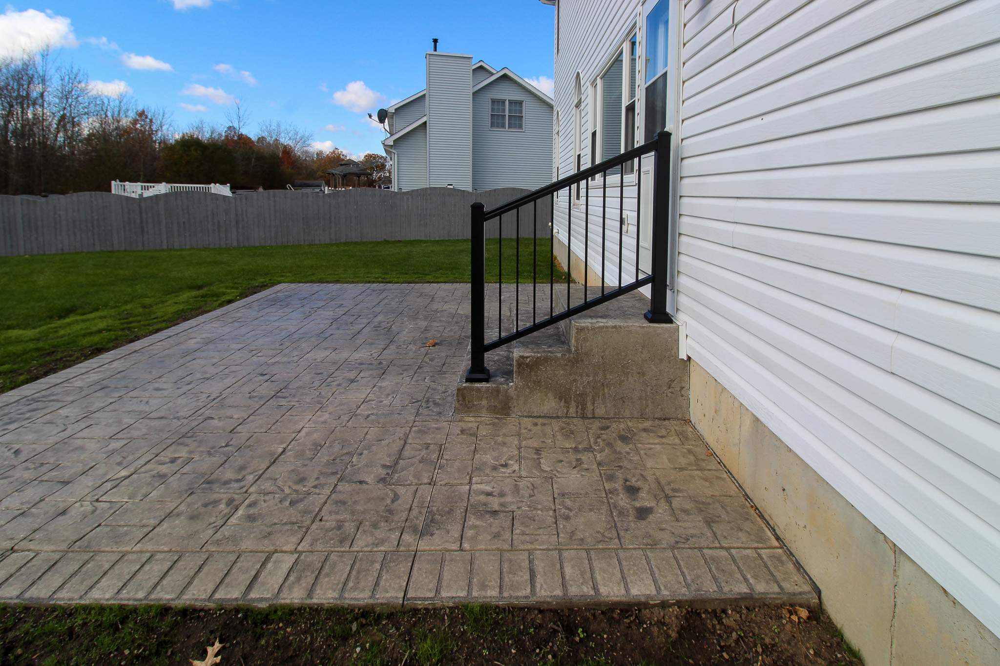 Stamped Concrete and Entry Door by Ivy Lea Construction