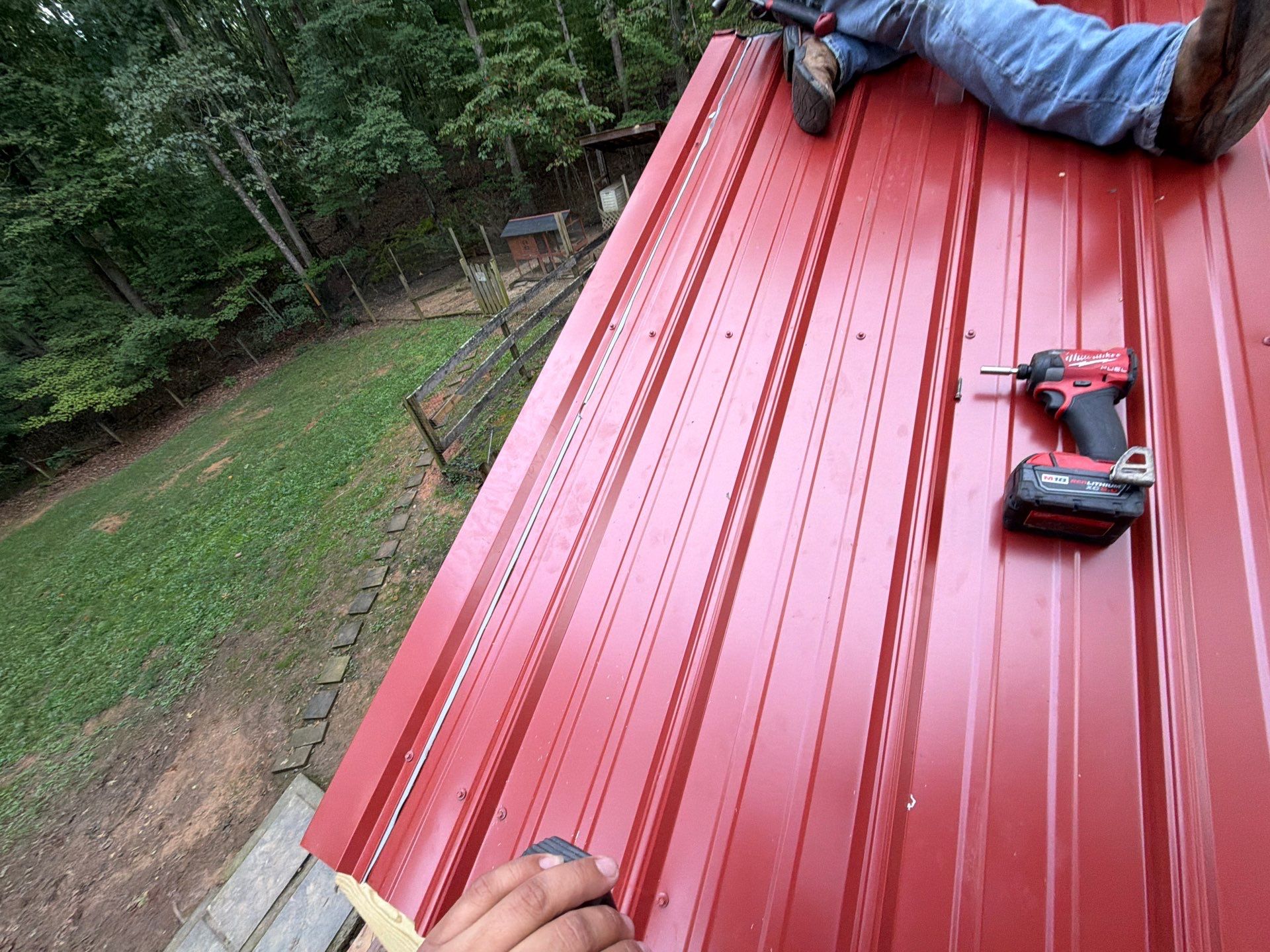 Red Metal Roof Restoration and Wood Fascia Replacement in Barboursville by Cade Construction