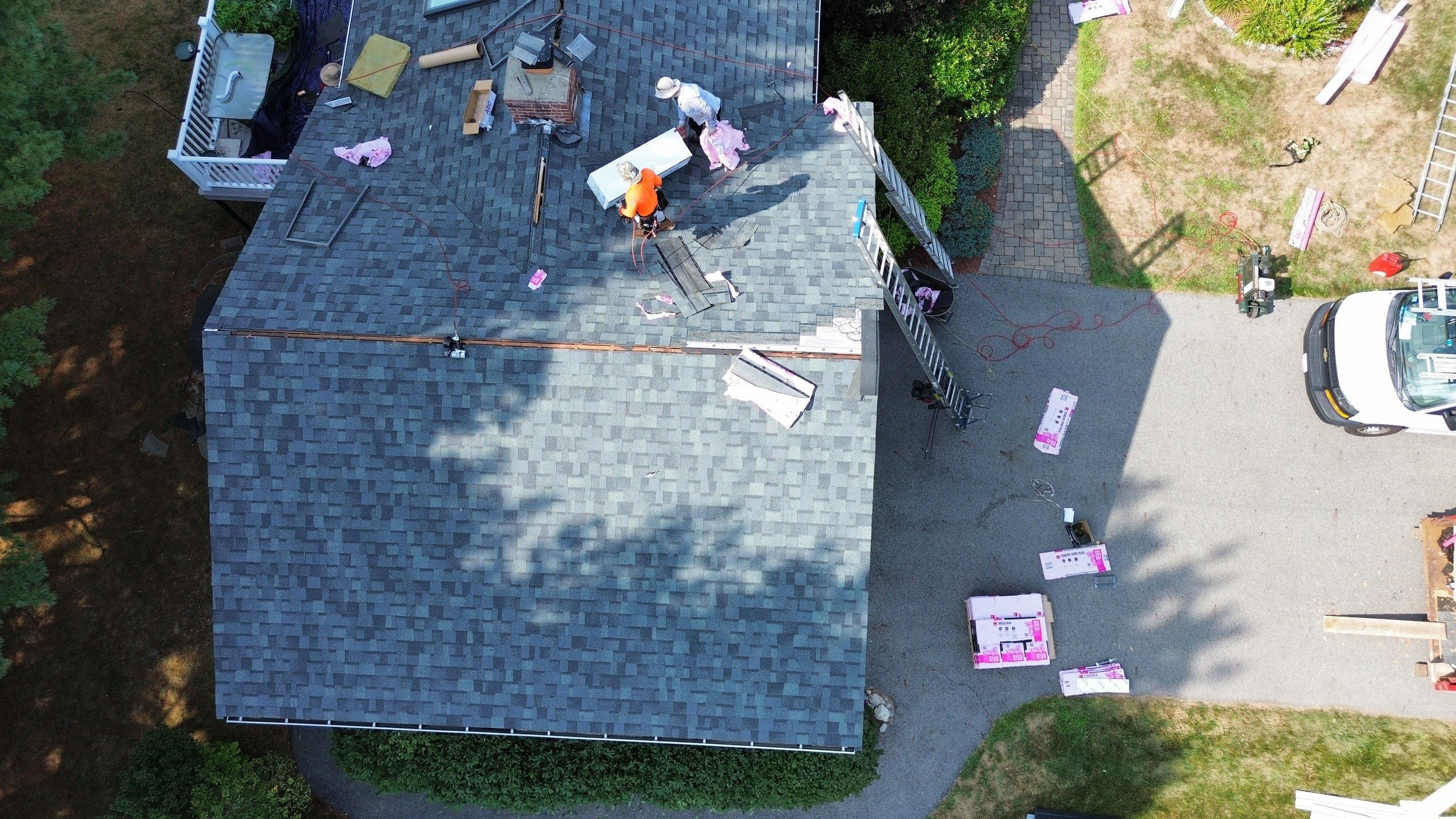 Complete Roof Replacement with Chimney Flashing, Gutter Guard System, and Vinyl Siding Repairs by Mighty Dog Roofing of Greater Middlesex County