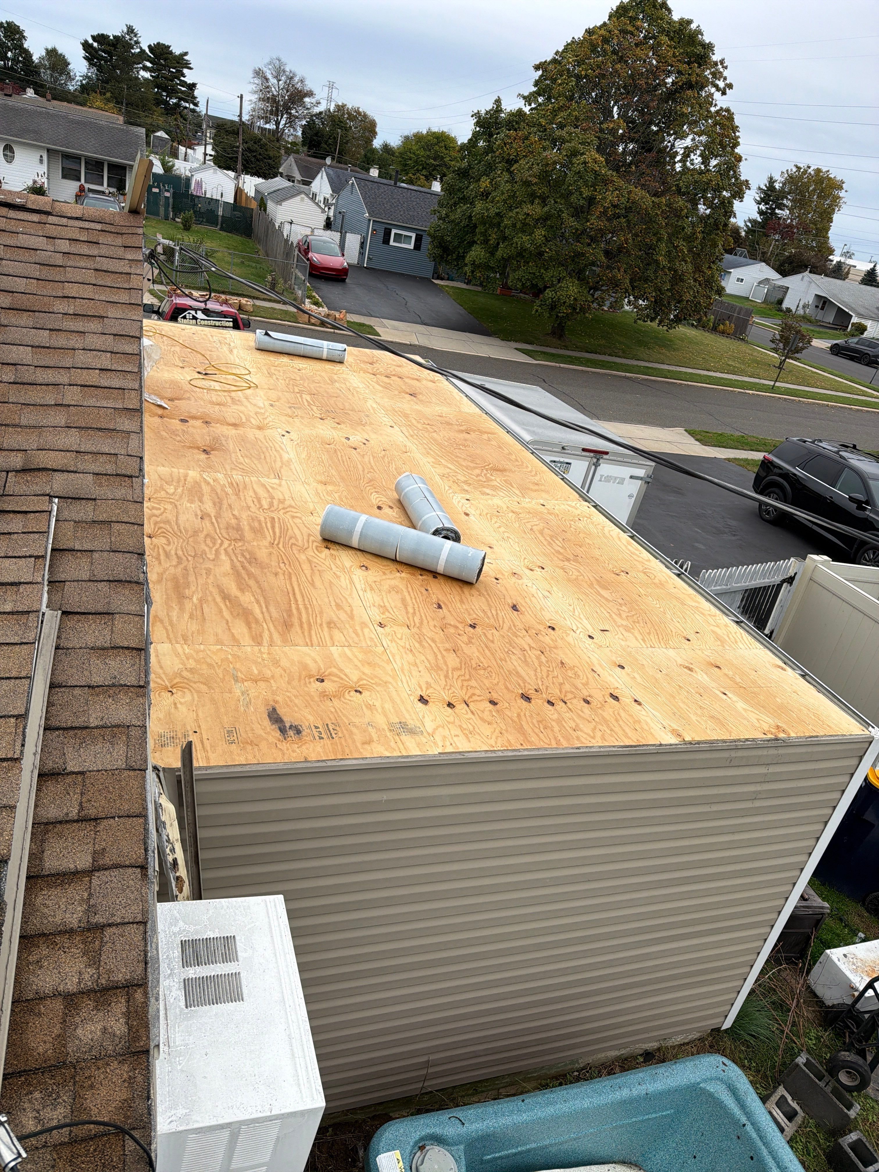 Flat Roof Replacement and Shingle Integration in Levittown by Stofan Construction LLC