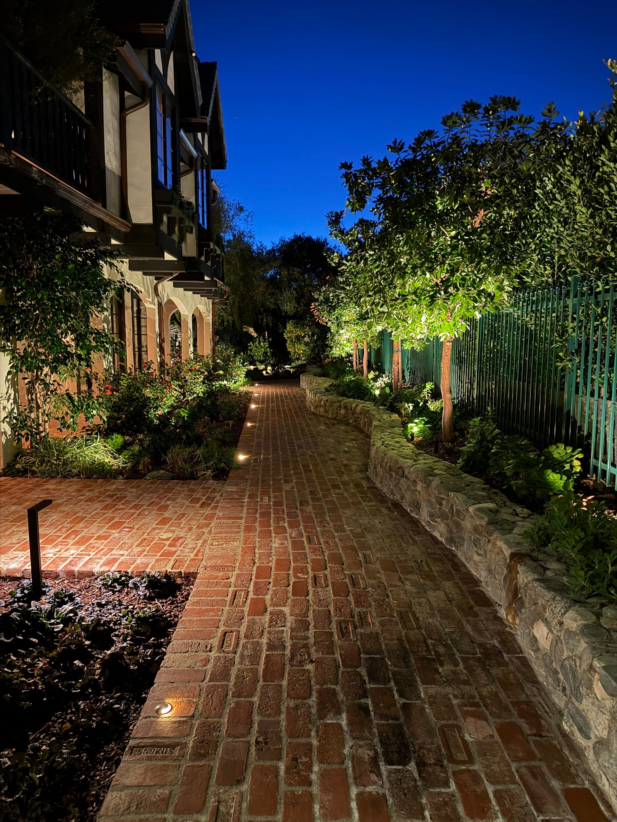 Tudor Estate Landscape Lighting with Integrated Stone Step Illumination by Outdoor Lights + Shades