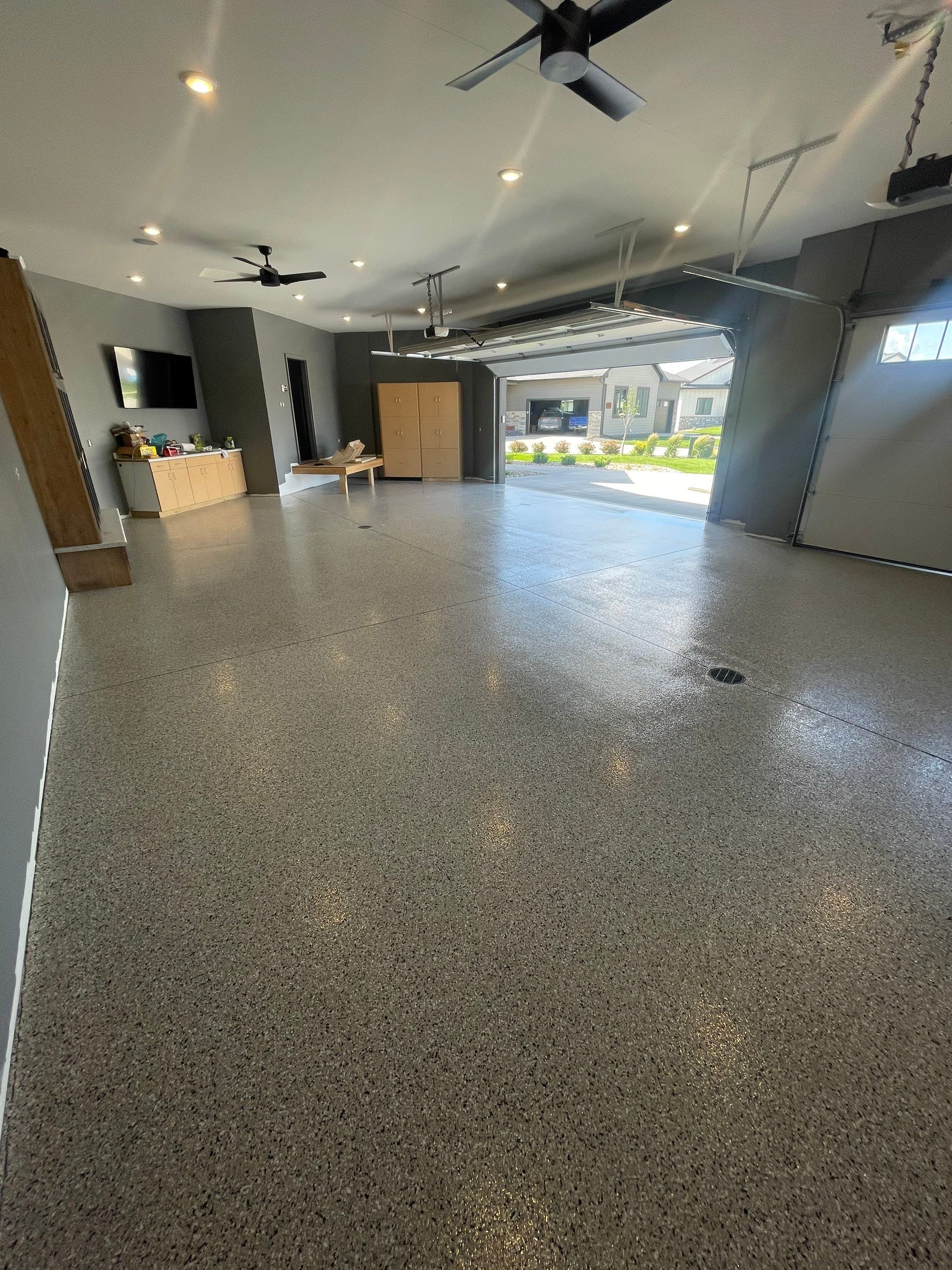 Custom Speckled Concrete Coating for Dell Rapids Garage by Select Painting, Coatings & Garage Cabinets