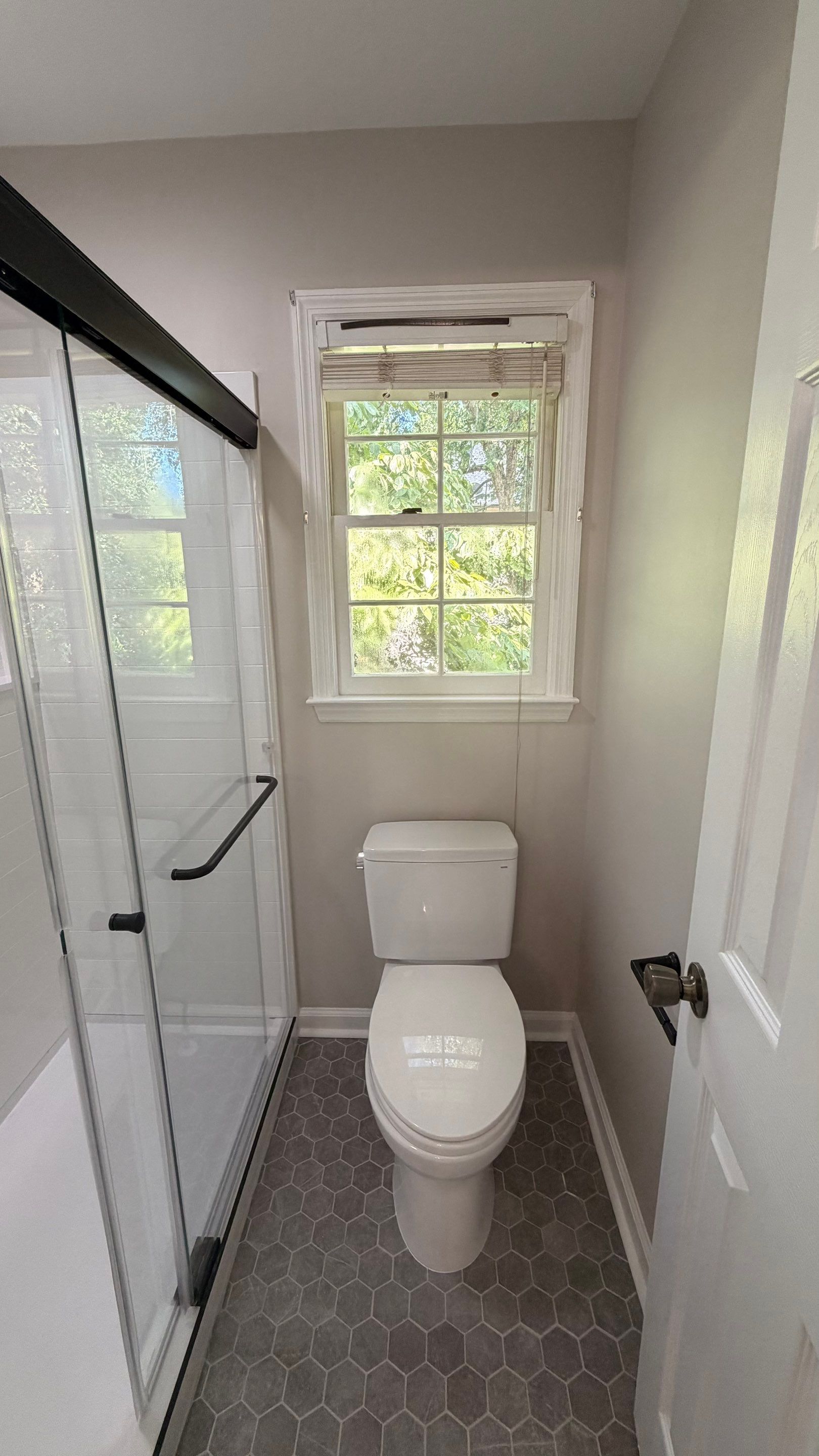 Modern Bathroom Remodel With Quartz Countertops and Hexagonal Tile in Acworth by Swift Home Renovations