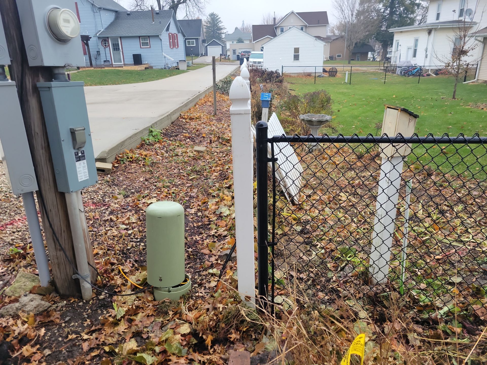 Black Vinyl-Coated Chain Link Fence Installation in Aplington by Perfect Picket Fence and Stain