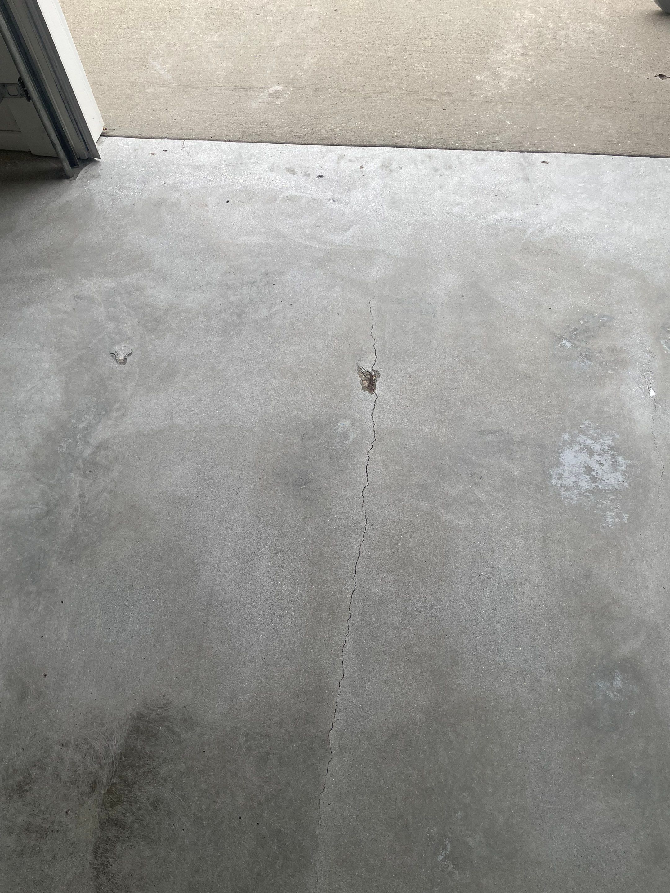 Coyote Flake Garage Floor Coating in Worthington, Minnesota by Select Painting, Coatings & Garage Cabinets