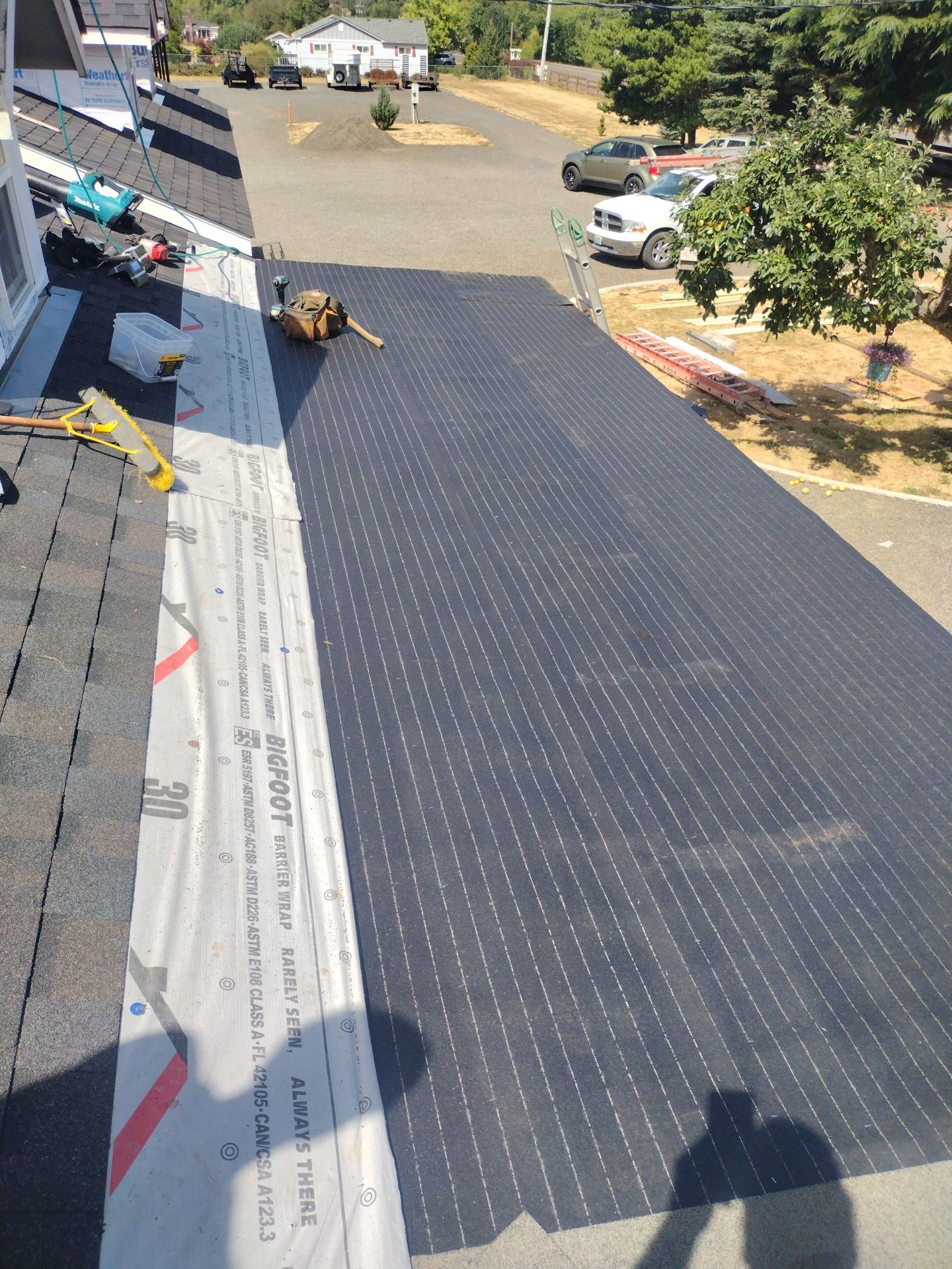 Residential Roof Replacement with Metal Accents by Orezona Building & Roofing Company, Inc.