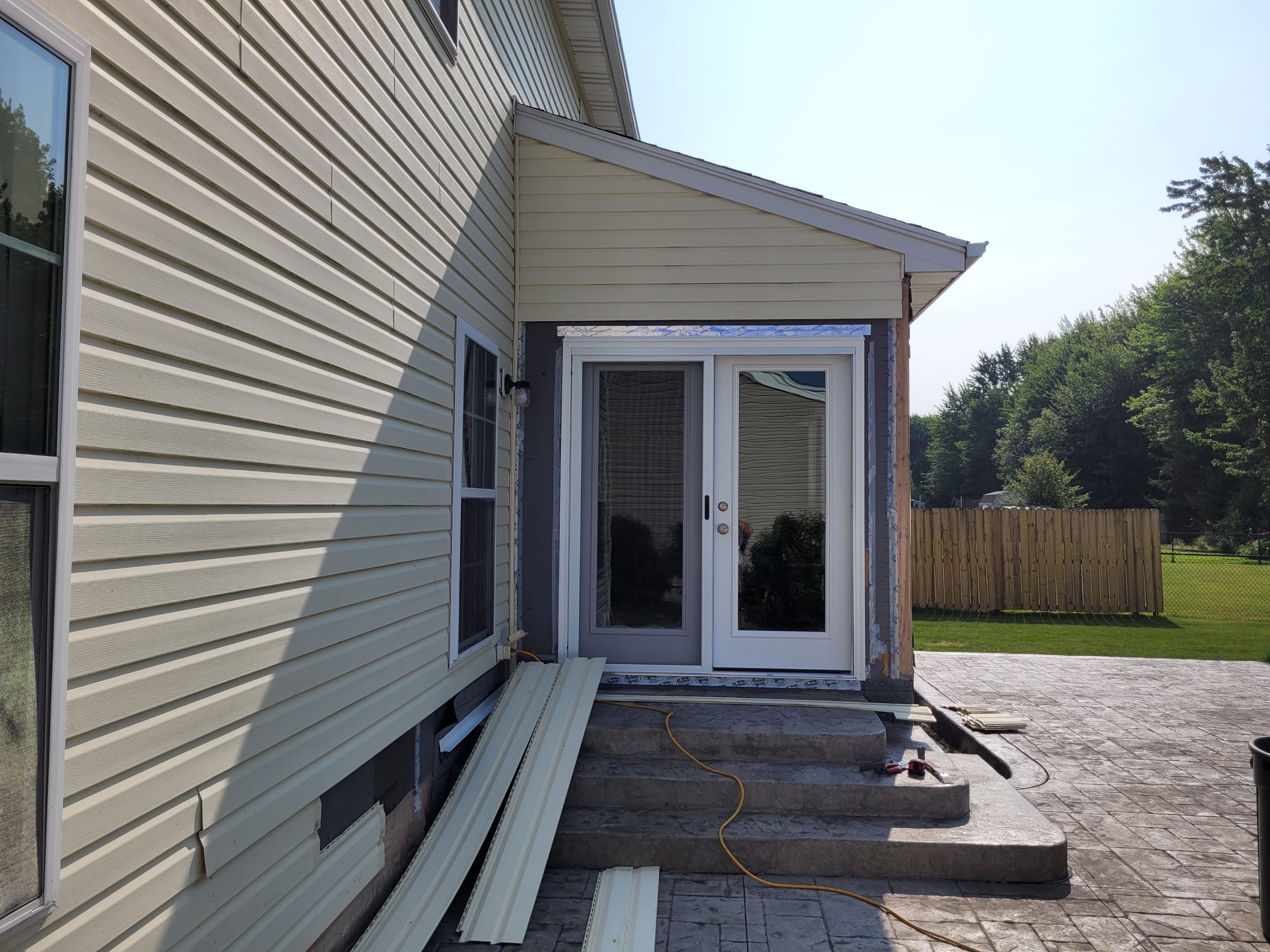 Stamped Concrete, Entry Door, and Concrete  by Ivy Lea Construction