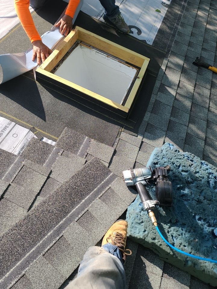 Impact Resistant Roof Replacement and Skylight Project in Norman Oklahoma by McCann's Roofing and Construction