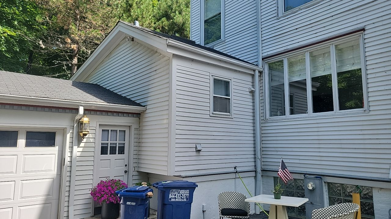 Housewashing  using Algaecide, soft wash soap by Northern Power Washing LLC.