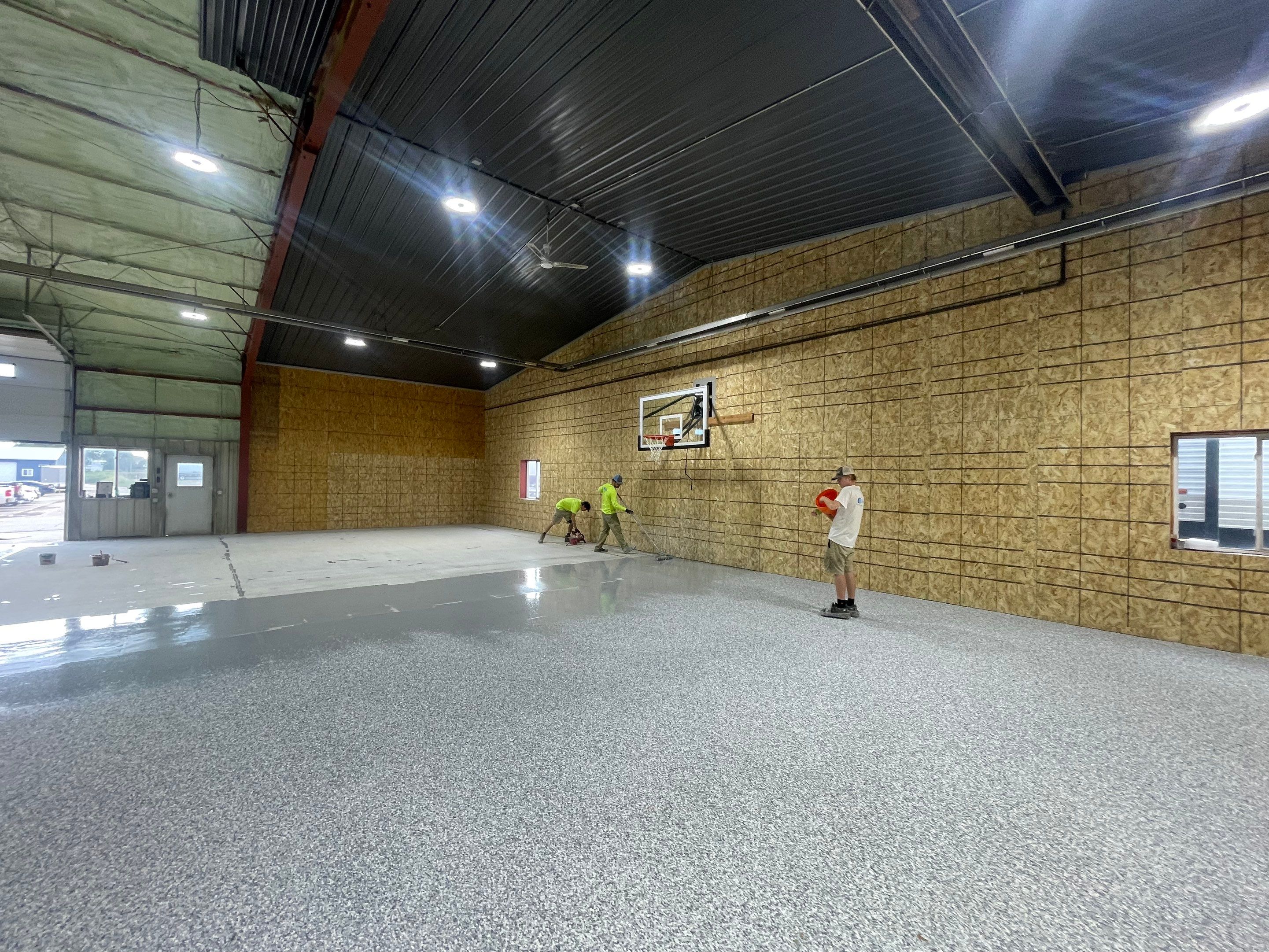 Custom Polyurea Shop Floor with Basketball Court Lines in Rock Valley by Select Painting, Coatings & Garage Cabinets