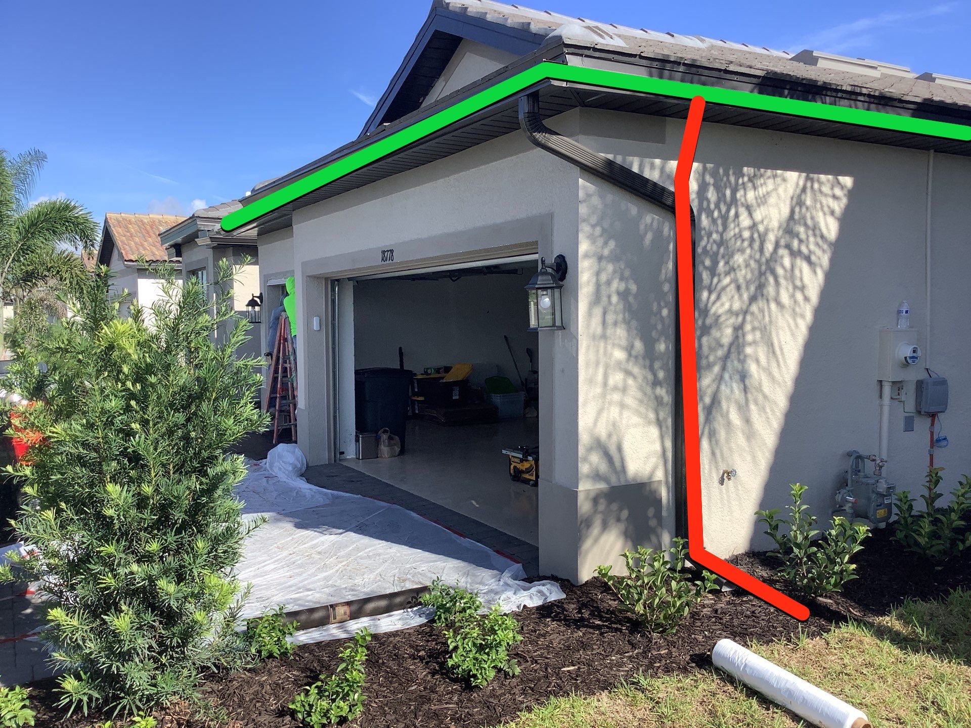 Seamless brown gutter and downspouts installation in Estero, FL  by Gutter Professors
