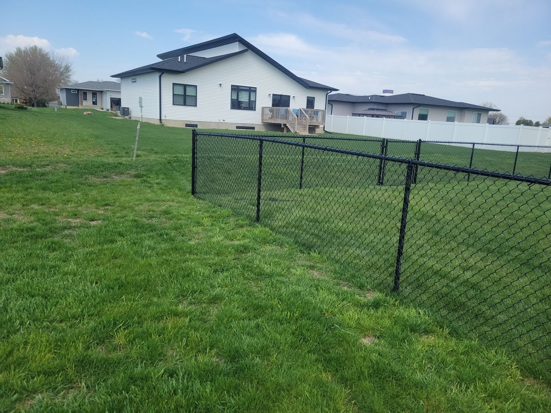 Black Chain Link Fence and Gate Installation in Cedar Falls by Perfect Picket Fence and Stain